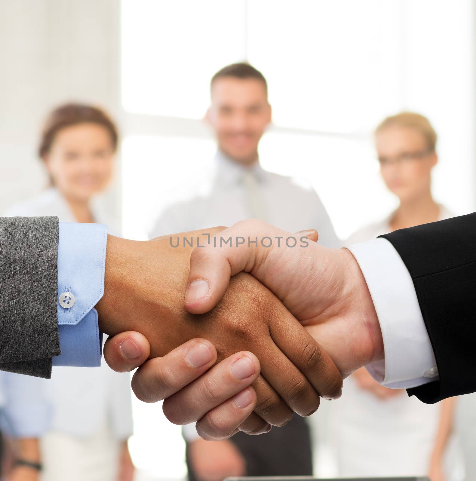 business and office concept - businessman and businesswoman shaking hands