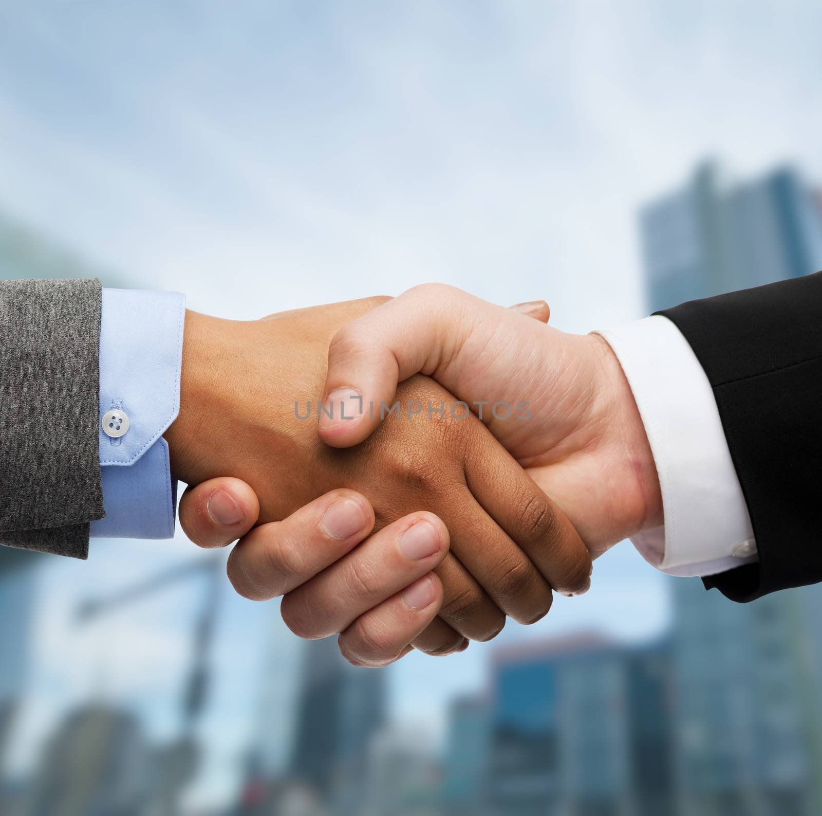 business and office concept - businessman and businesswoman shaking hands