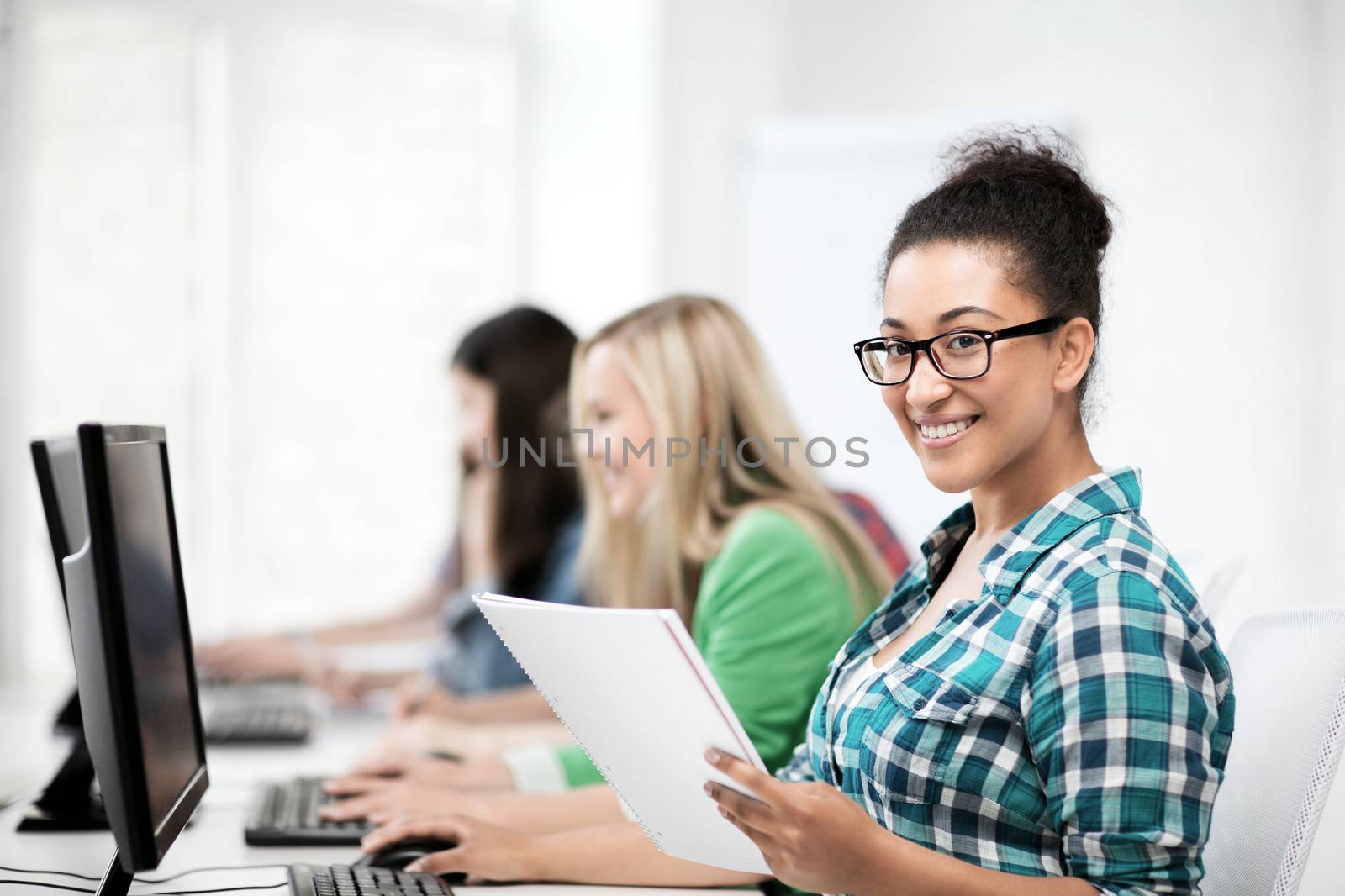 education, technology and internet - african student with computer studying at school