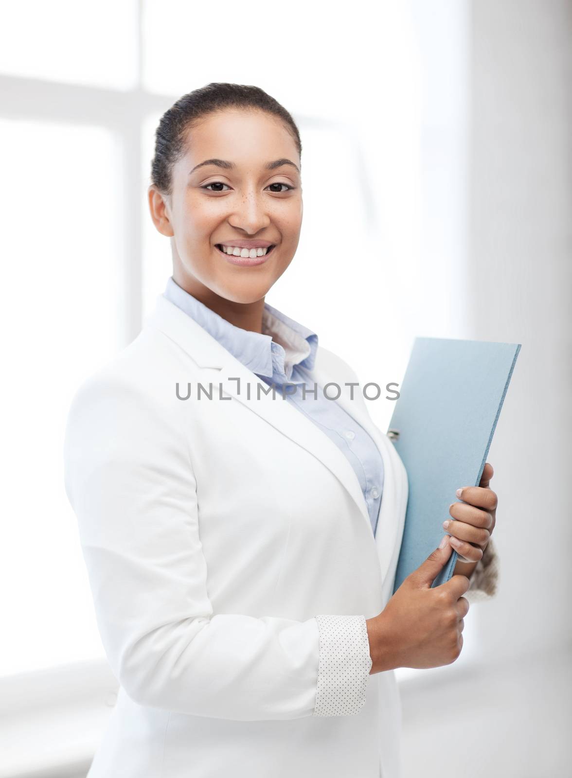 business and education concept - african businesswoman with folder in office