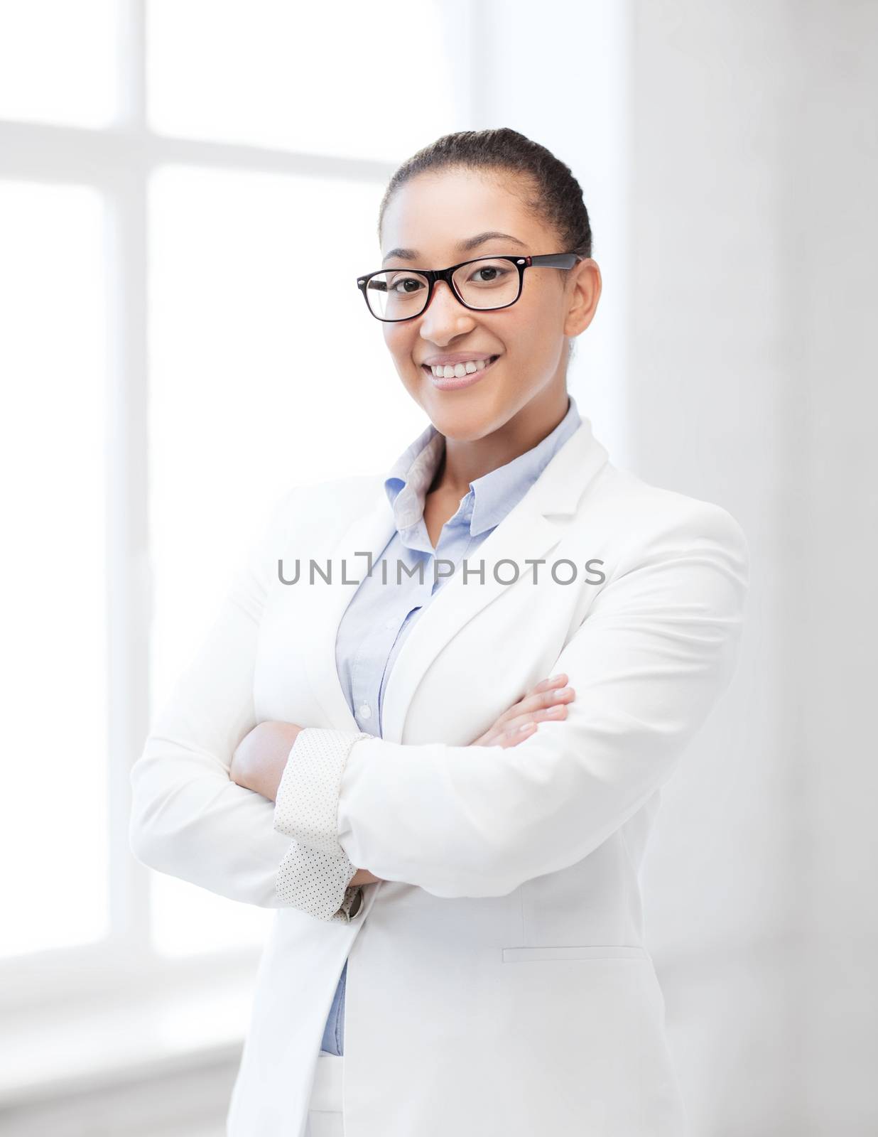 business and education concept - african businesswoman in office