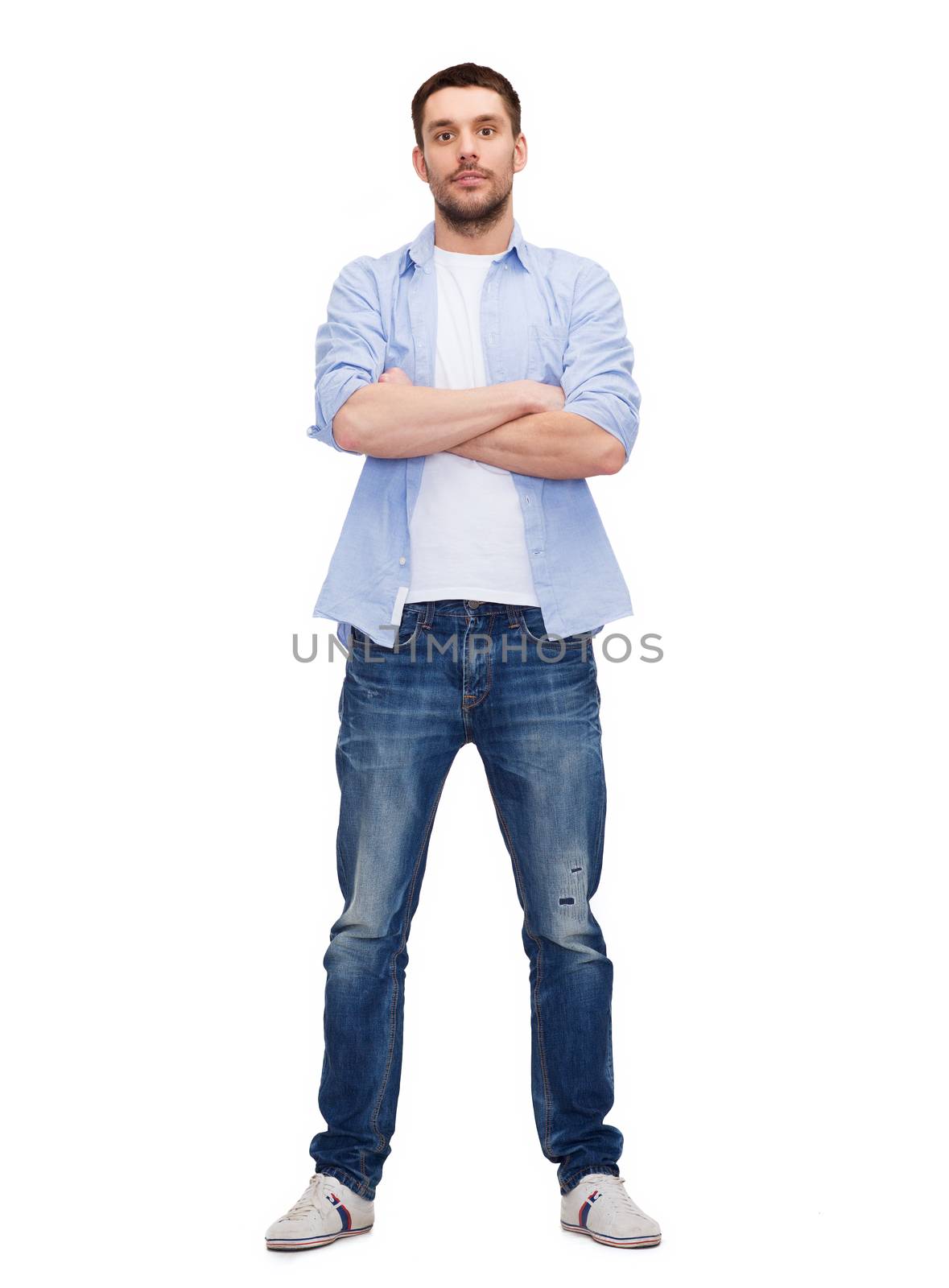 happiness and people concept - calm man with crossed arms