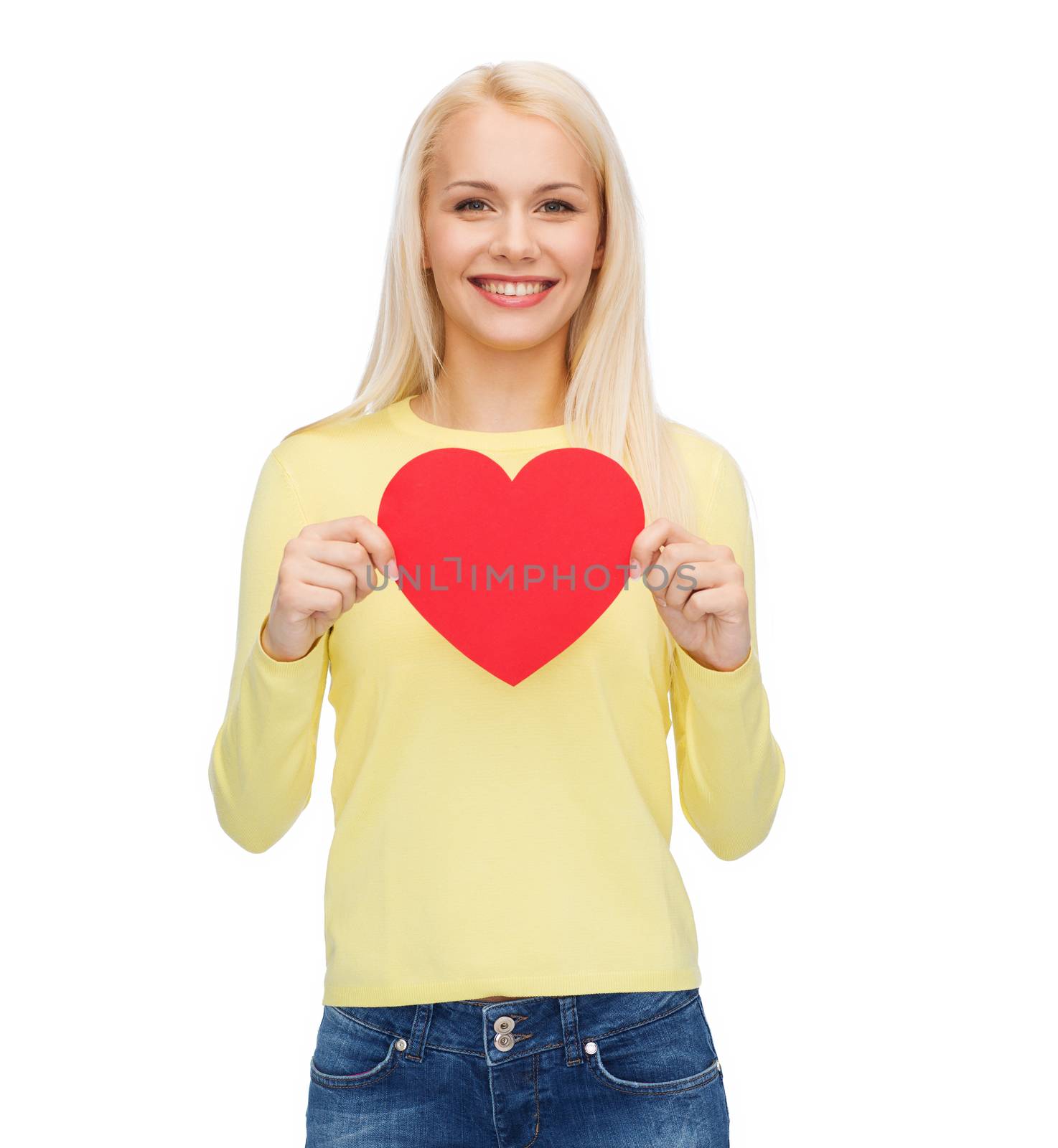 happiness, health and love concept - smiling woman with red heart