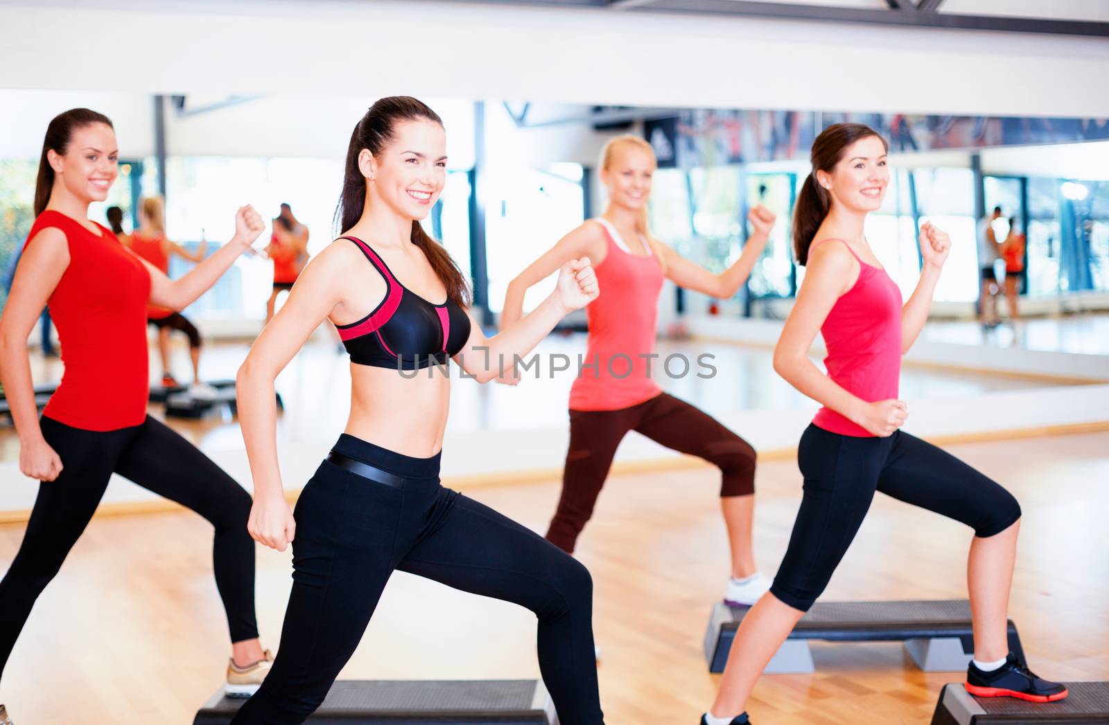 group of smiling people doing aerobics by dolgachov