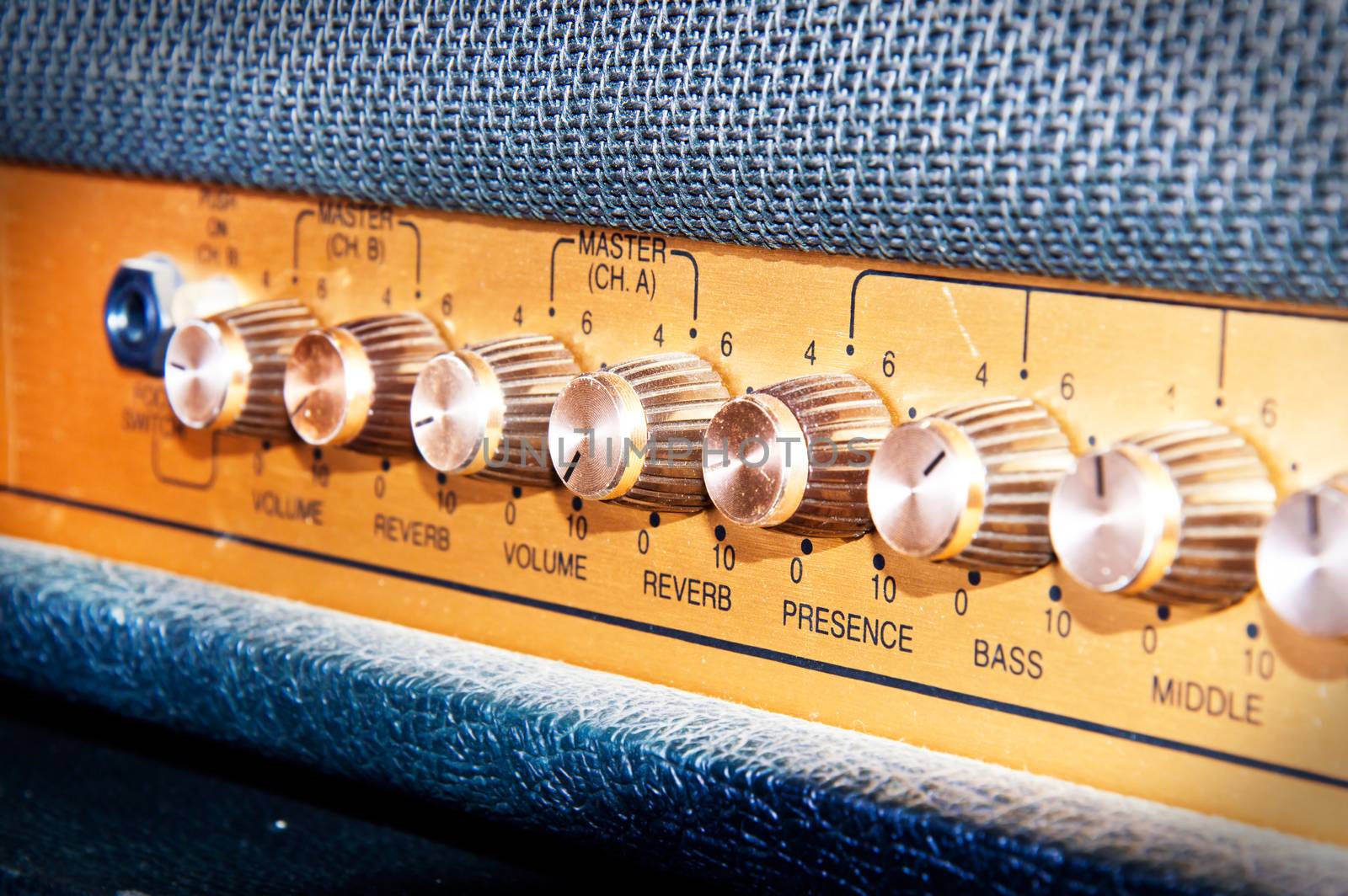 Sound volume controls of vintage guitar amplifier. Music and sound conceptual image.