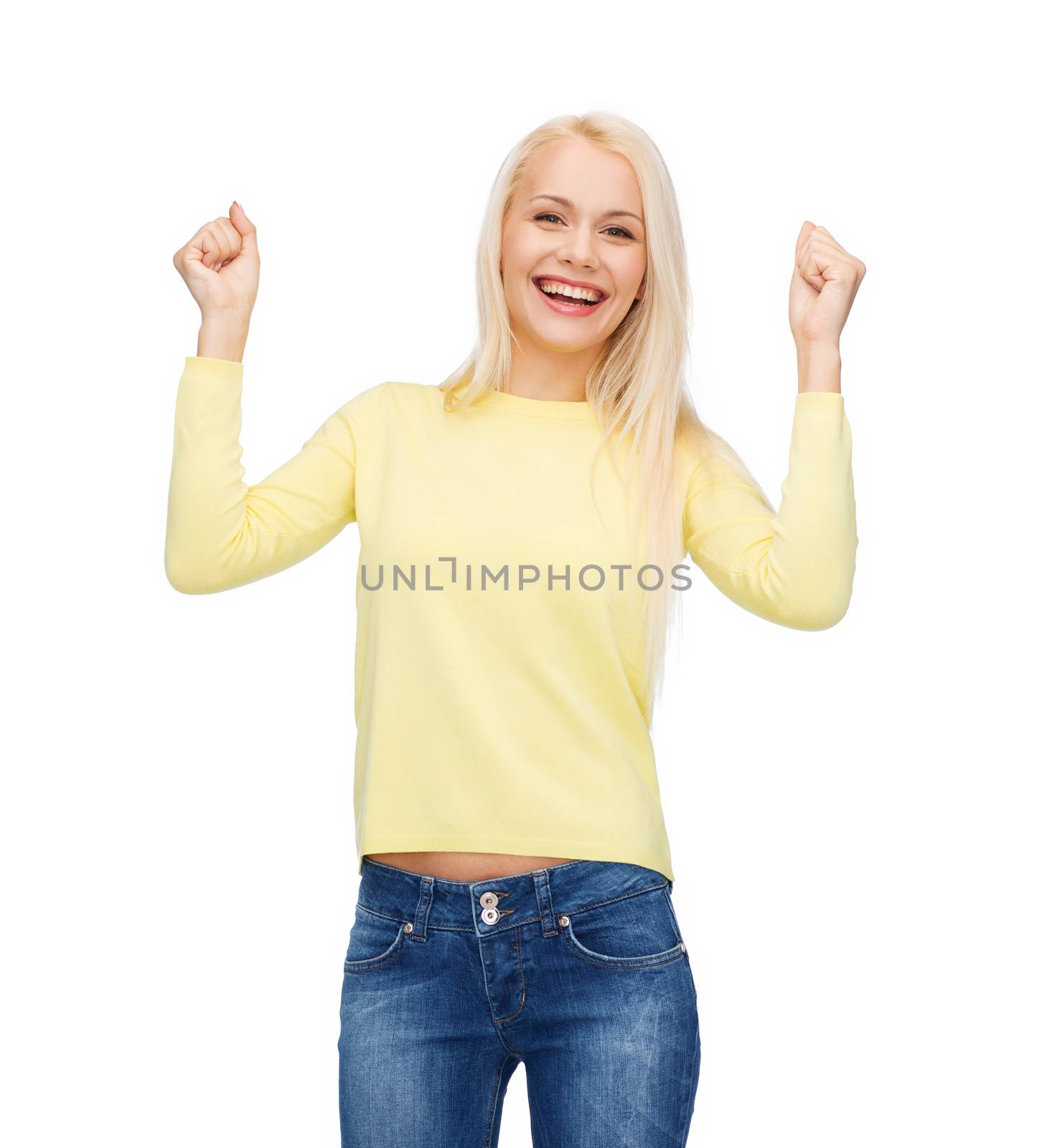 laughing young woman with hands up by dolgachov