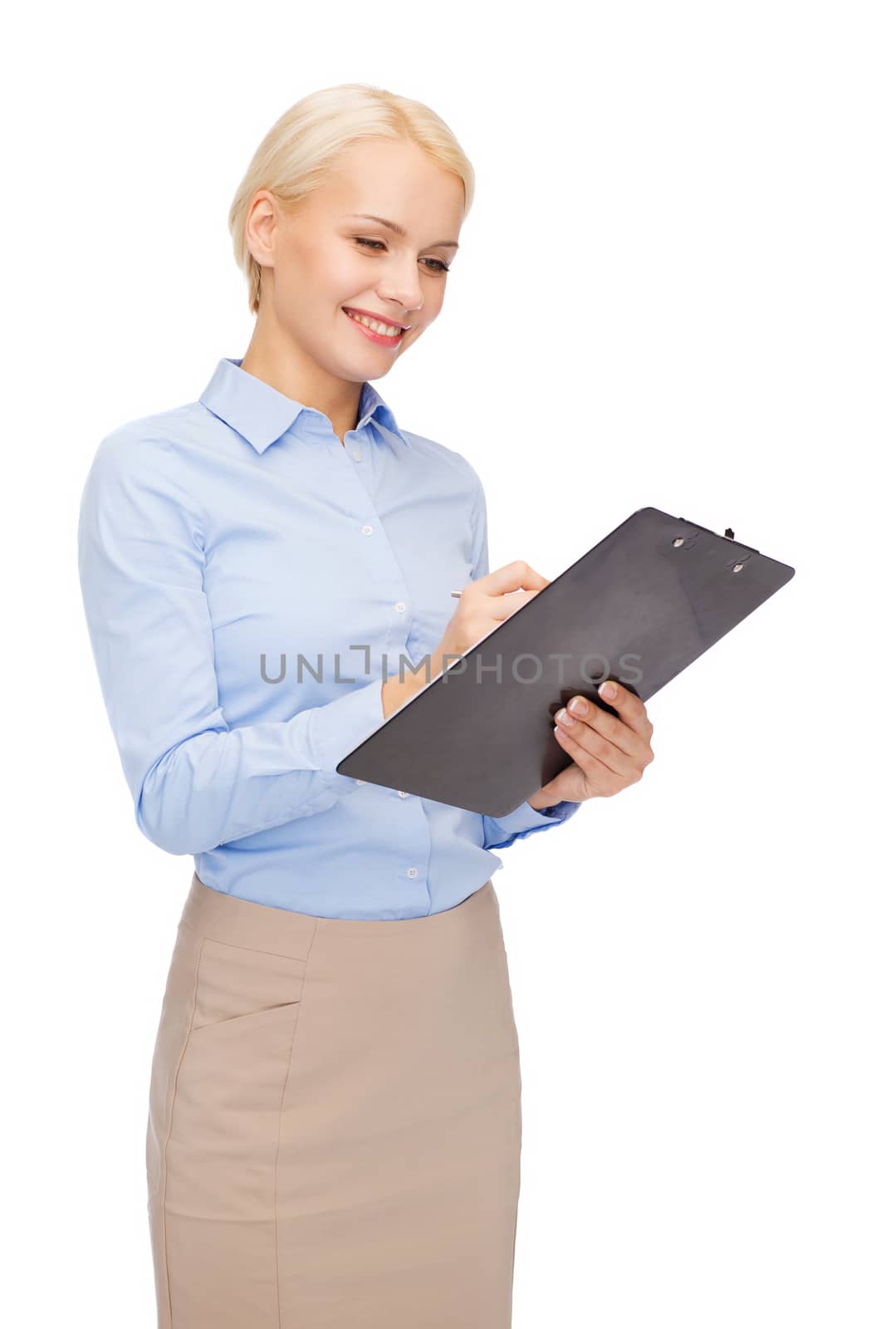 business and education concept - friendly young smiling businesswoman with clipboard and pen