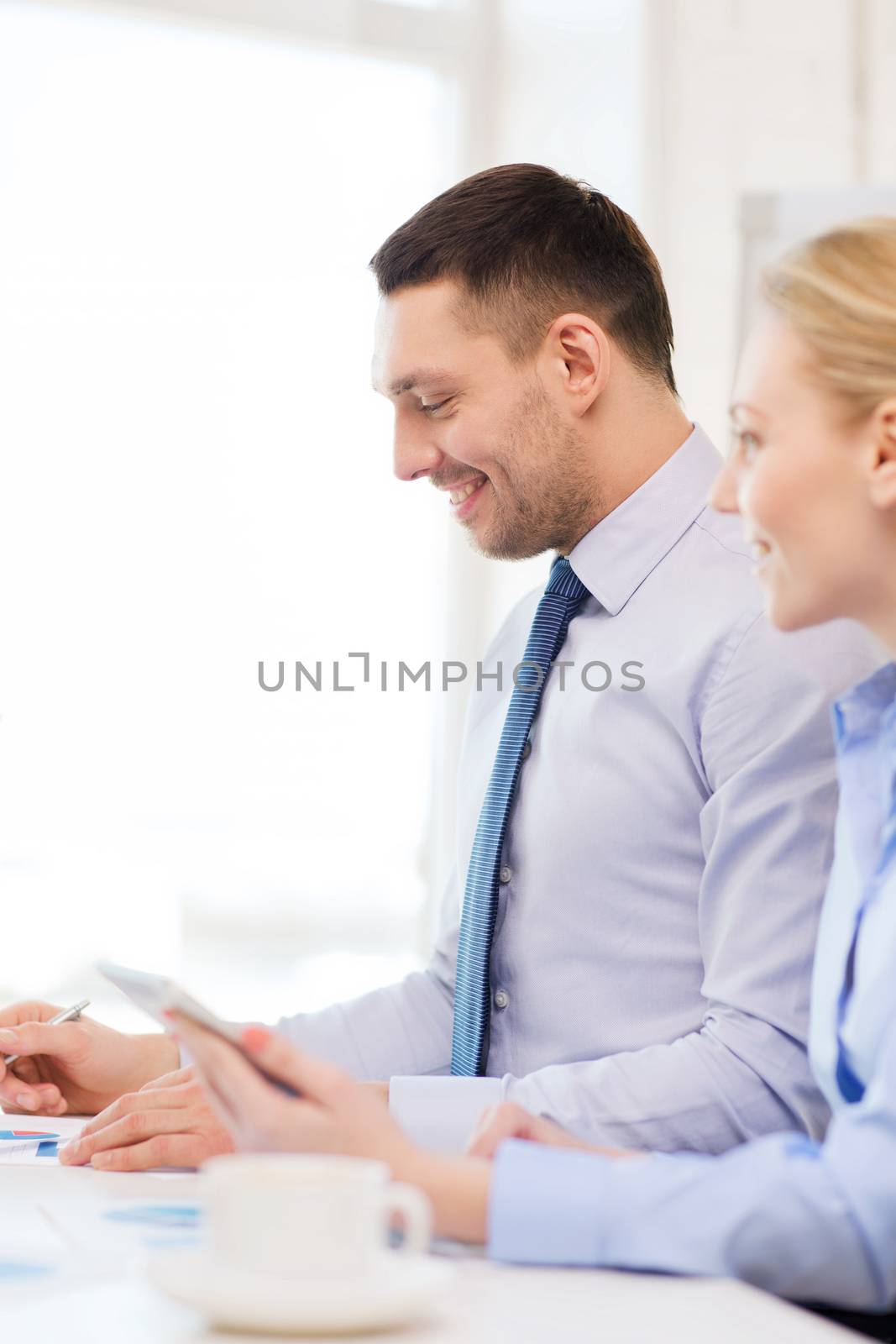 business and office concept - smiling businessman working in office