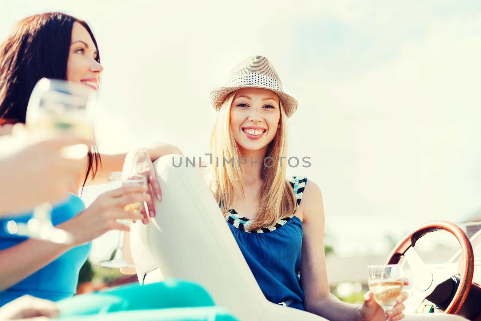 summer holidays and vacation - girl with champagne glass on boat or yacht