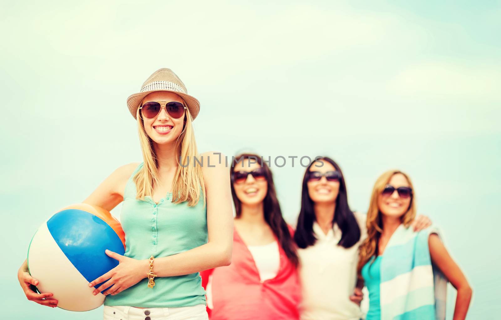 girl with ball and friends on the beach by dolgachov