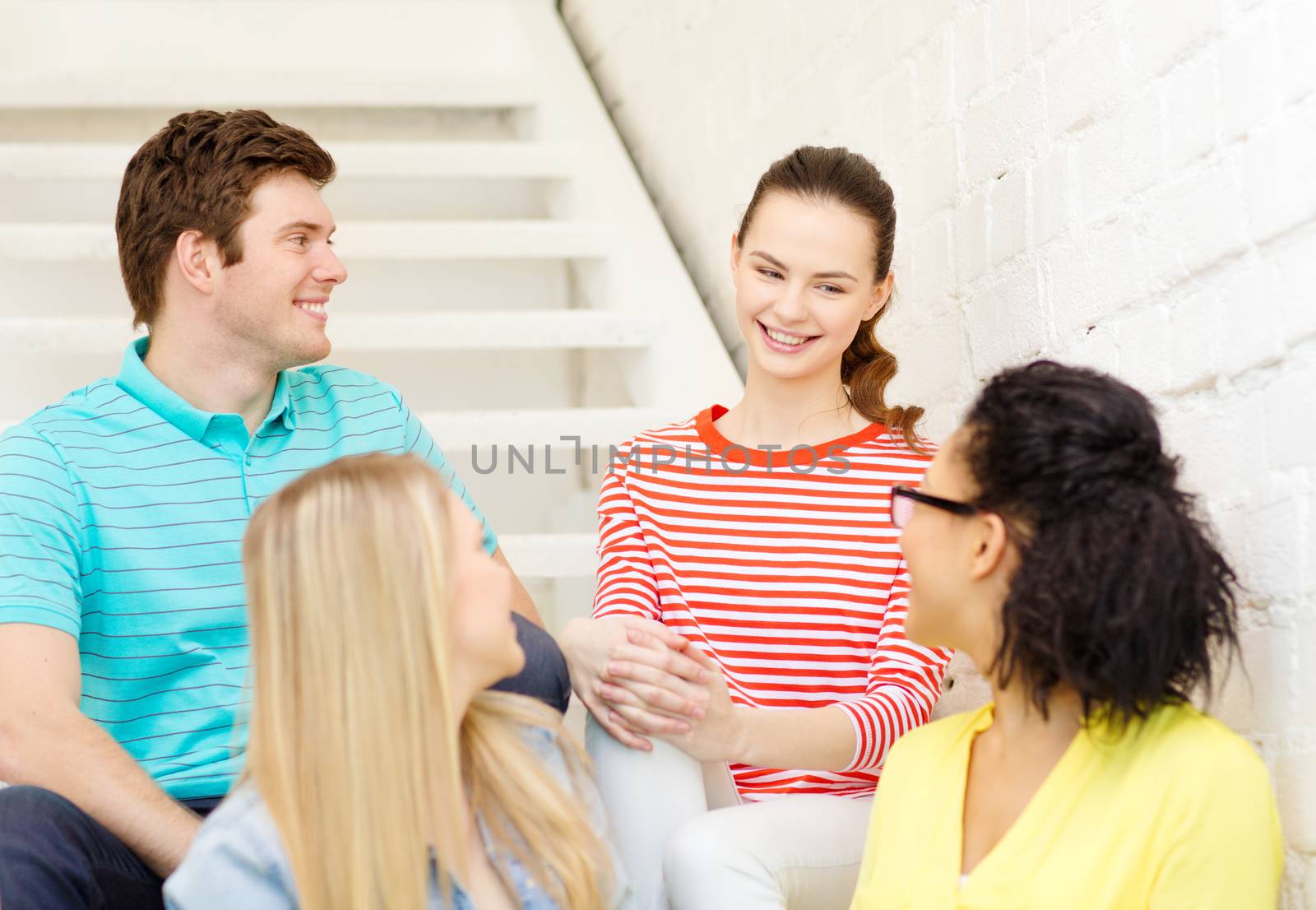 frienship and education concept - smiling teenagers hanging out