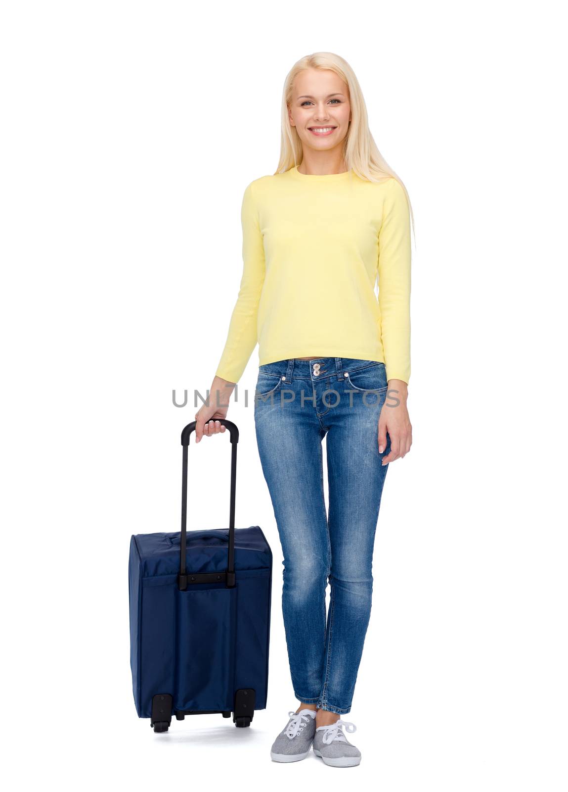 smiling young woman with suitcase by dolgachov