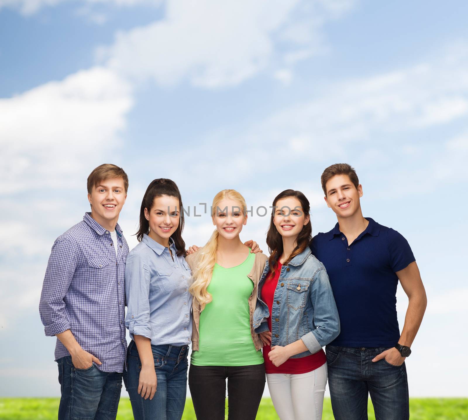 education and people concept - group of standing smiling students