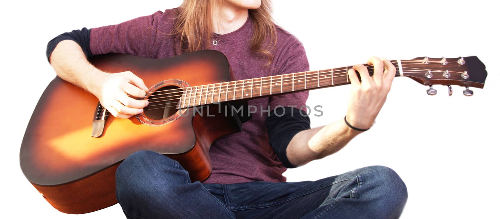 Music conceptual image. Rock musician. Guitarist play on his acoustic guitar.