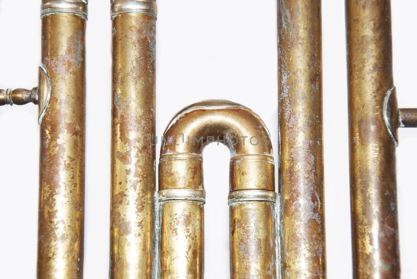 Close up of golden pipes on isolated background.