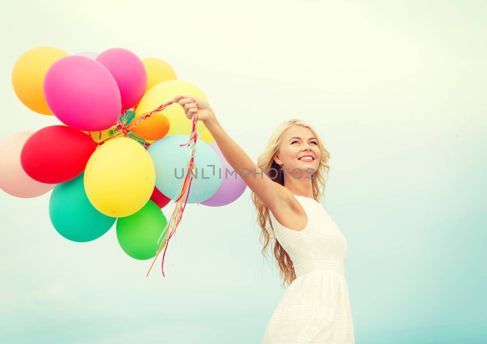 summer holidays, celebration and lifestyle concept - beautiful woman with colorful balloons outside