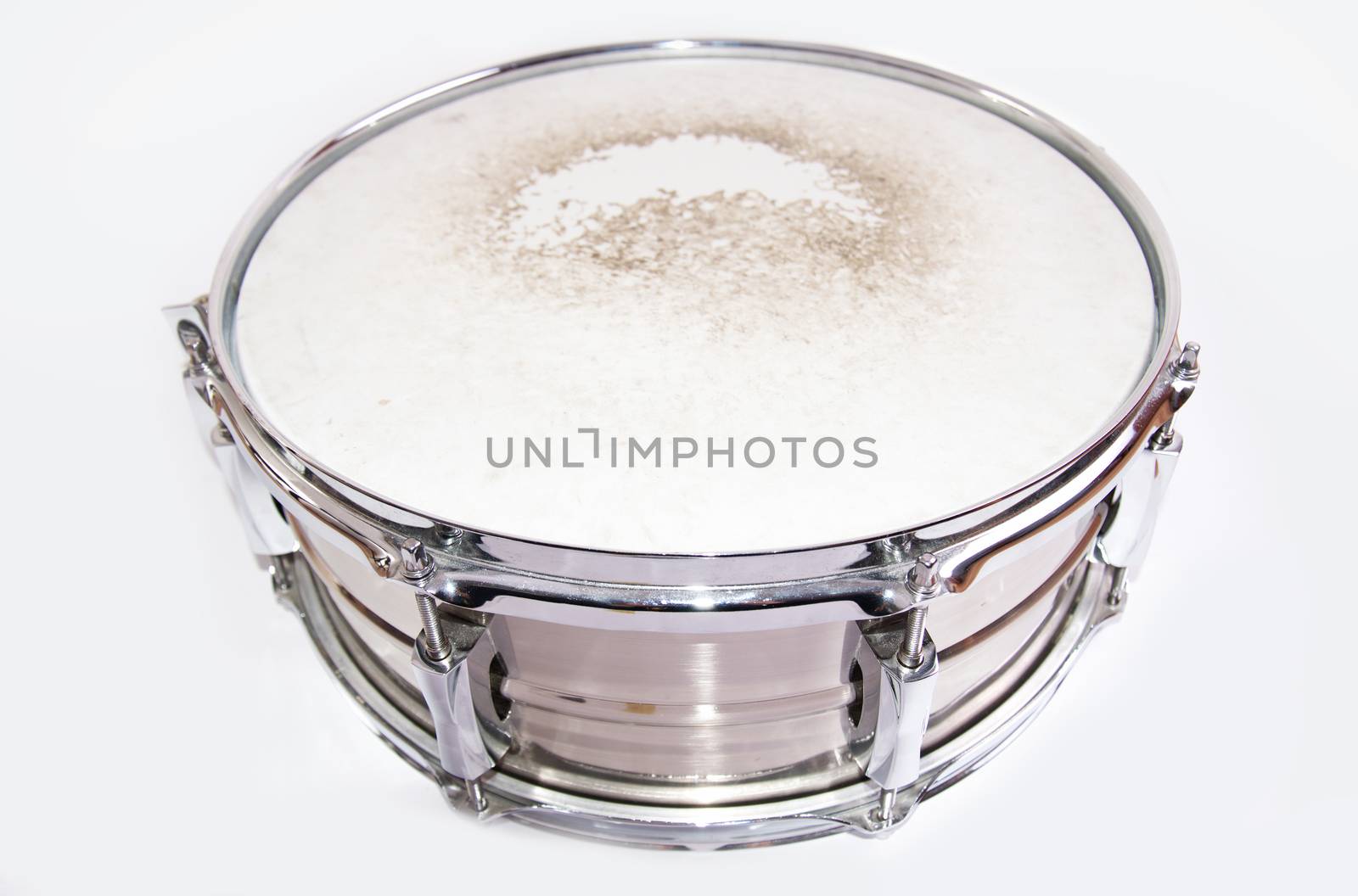 Music conceptual image. Close up of a drum snare on isolated background.