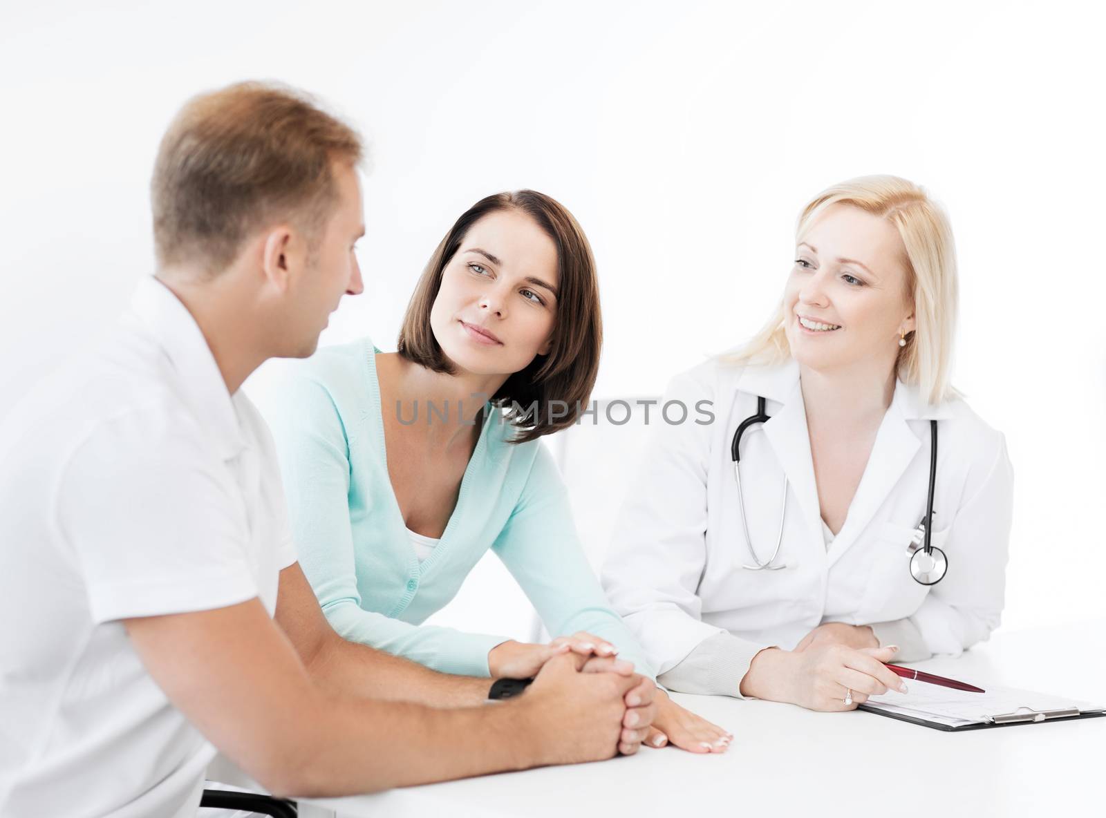 healthcare and medical concept - doctor with patients in cabinet