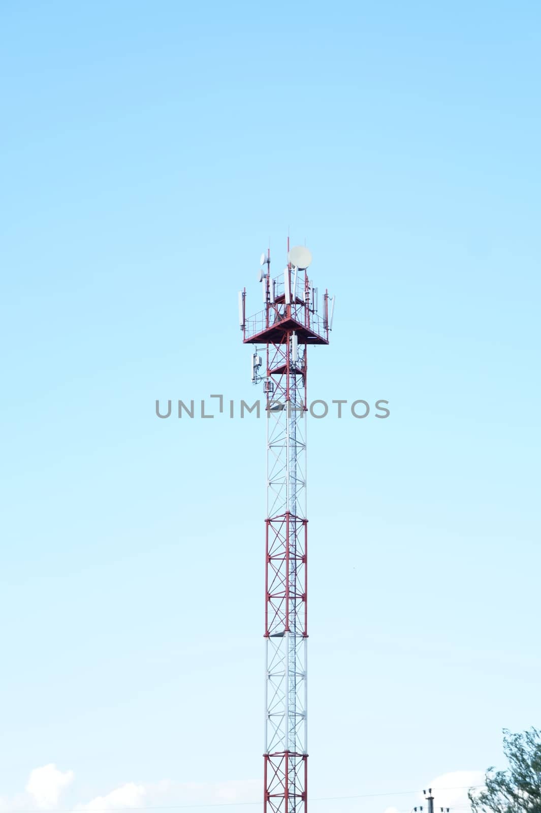 High iron cell tower on a background of blue sky