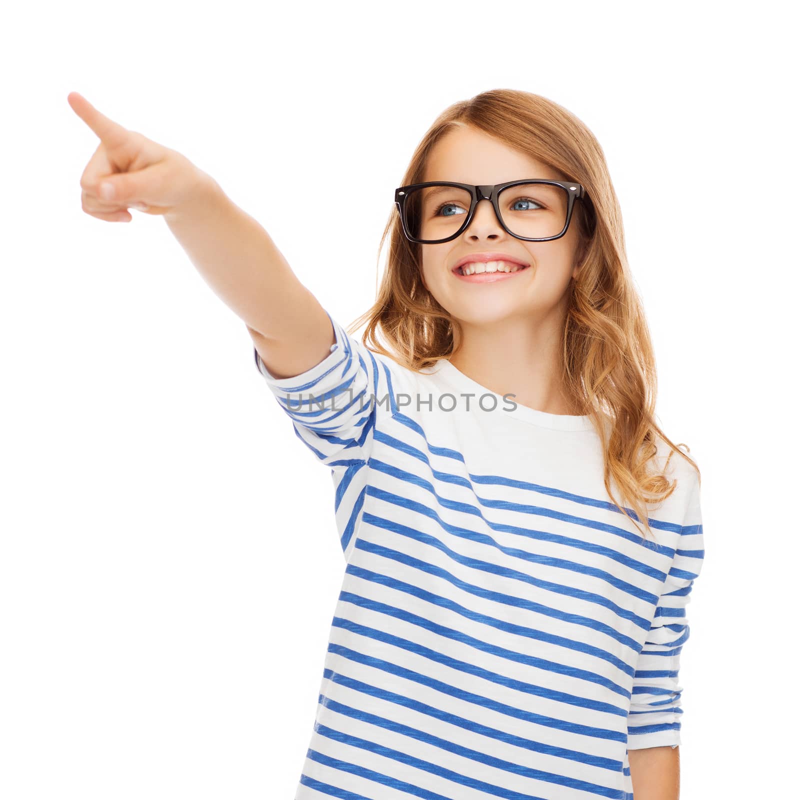 cute little girl in eyeglasses pointing in the air by dolgachov