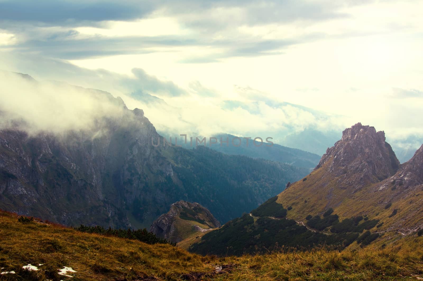 Clouds and fog over mountains. Beauty in nature landscape.