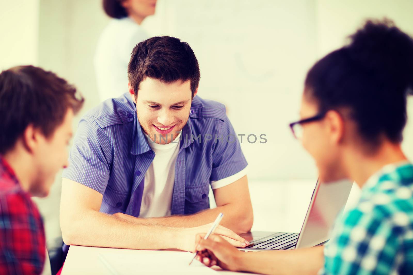 education concept - group of students studying at school