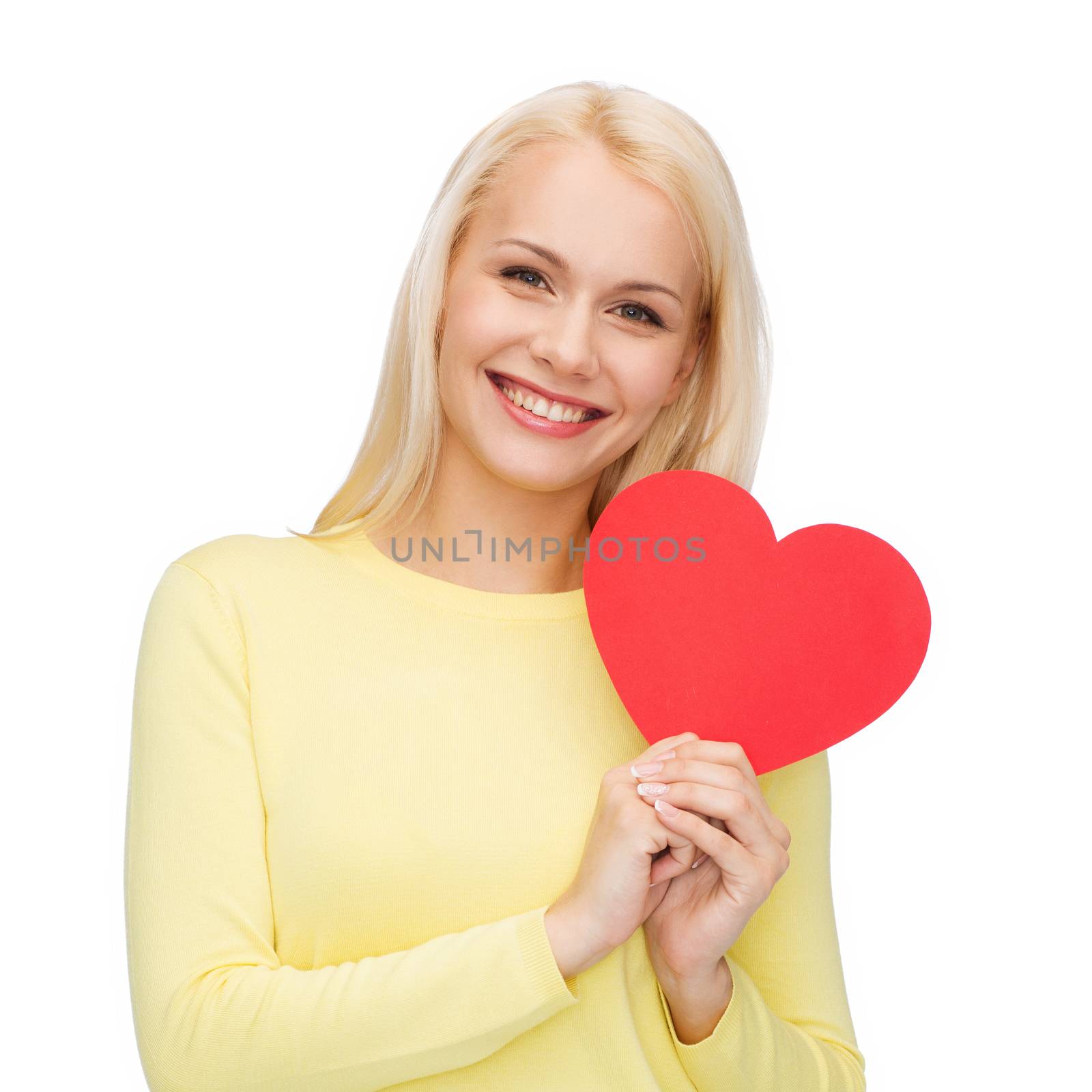 happiness, health and love concept - smiling woman with red heart