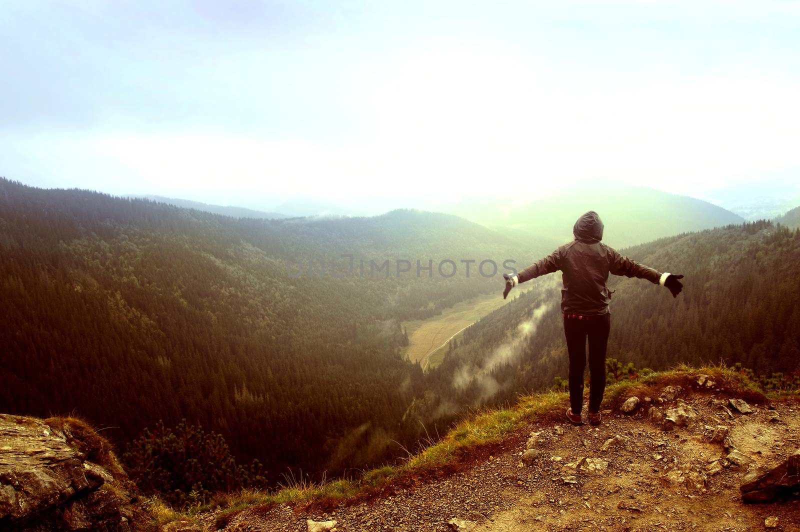 One person feel freedom in beautiful mountains scenery.