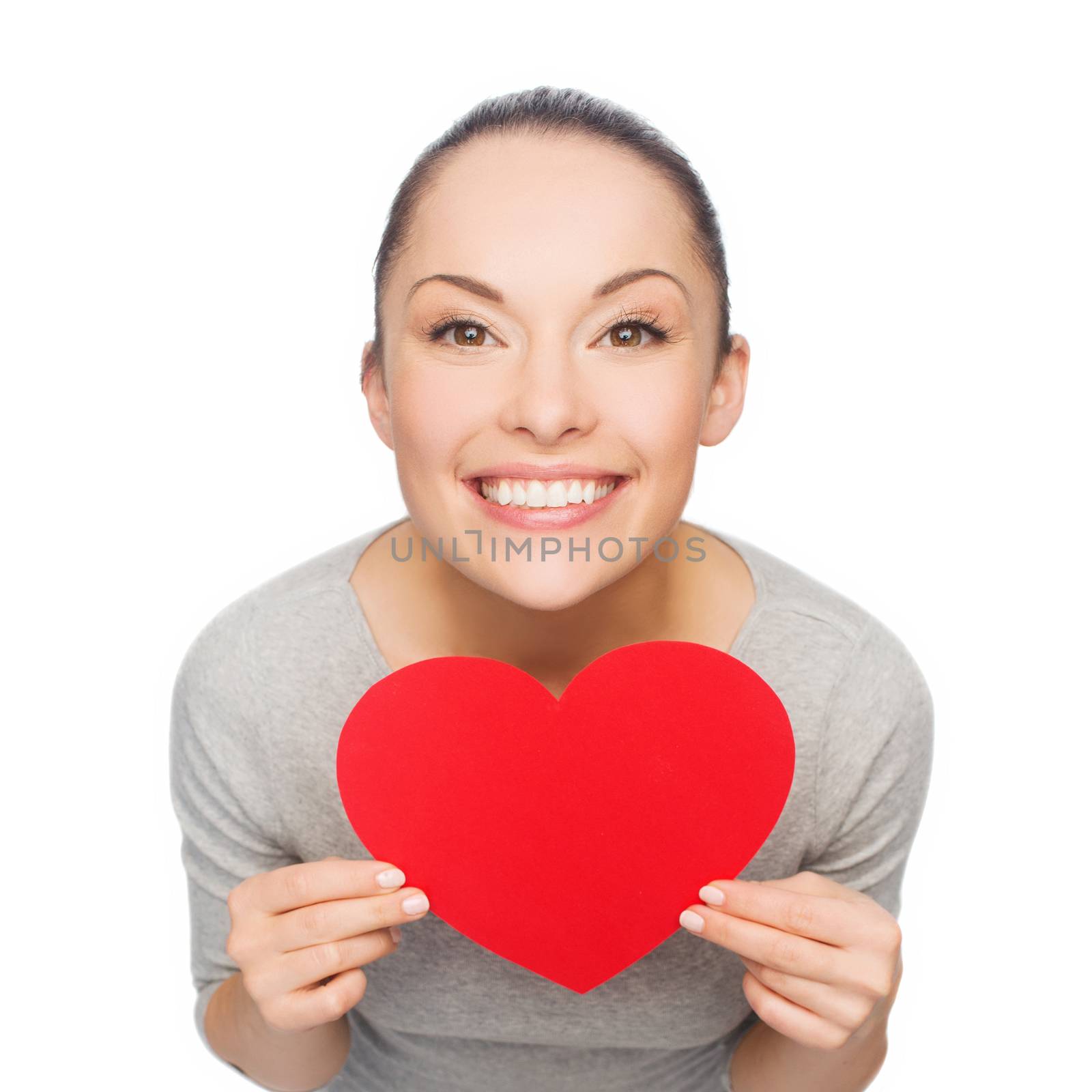 happiness, love and health concept - smiling asian woman with red heart