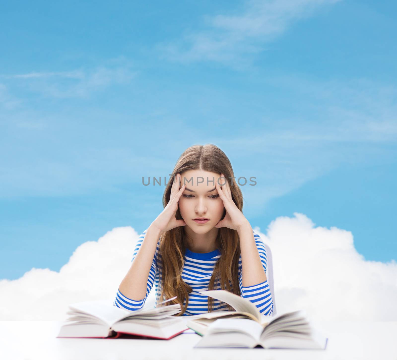 education and home concept - stressed student girl with books