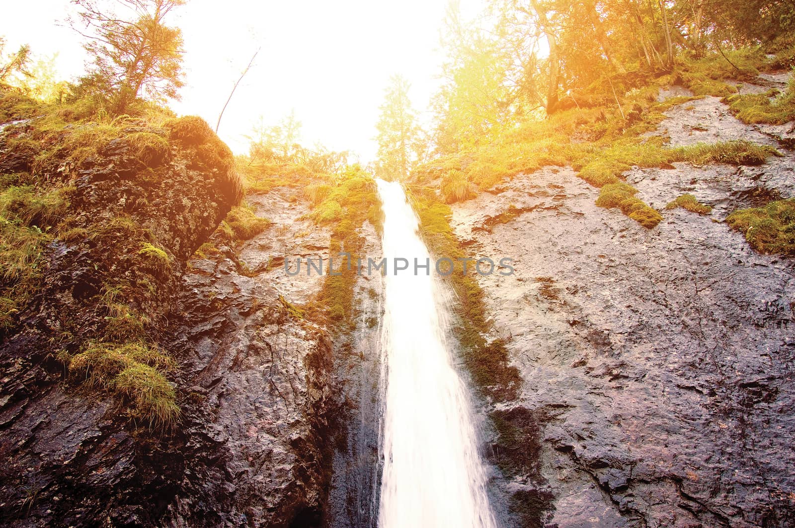 Waterfall in mountains. Nature conceptual image.