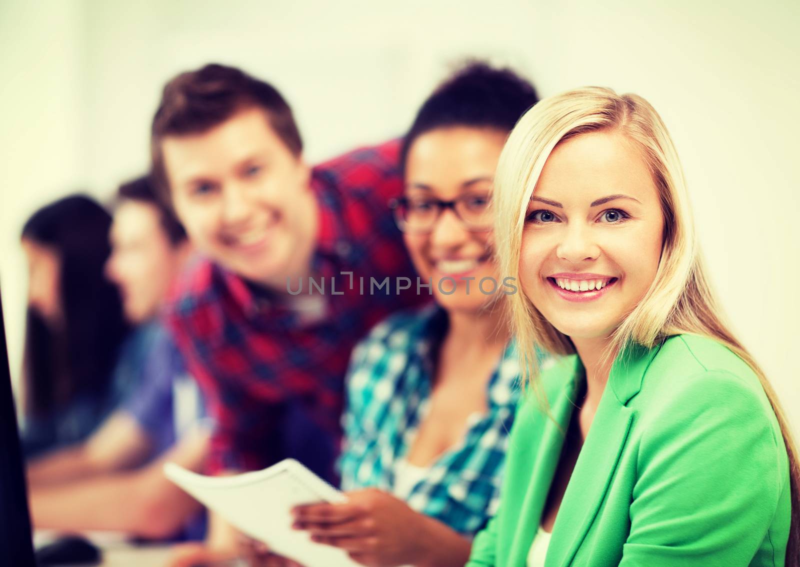 students with computer studying at school by dolgachov