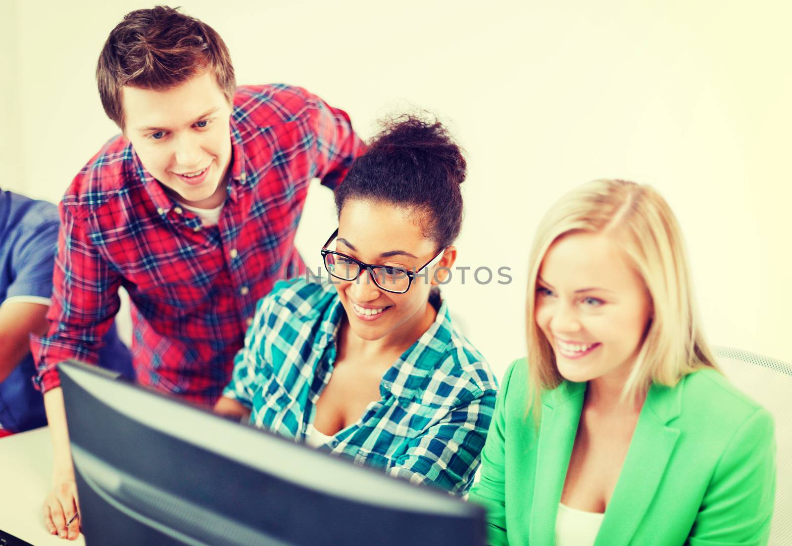 students with computer studying at school by dolgachov