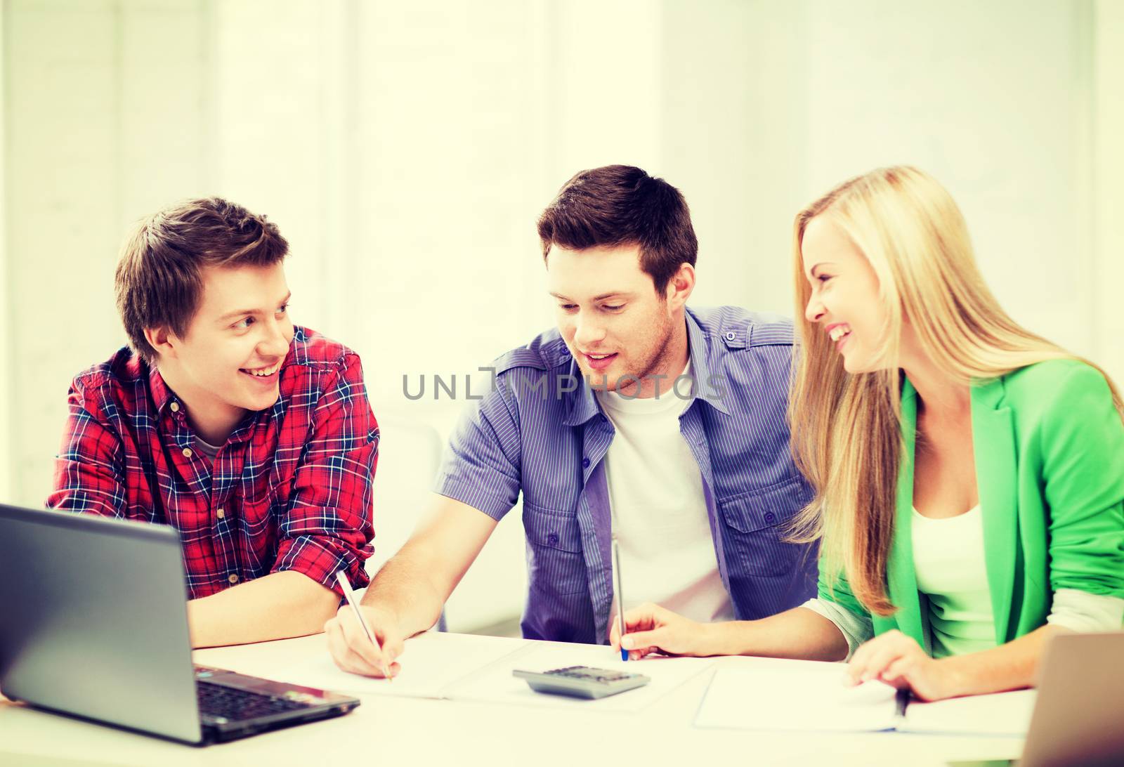 students chatting in lecture at school by dolgachov