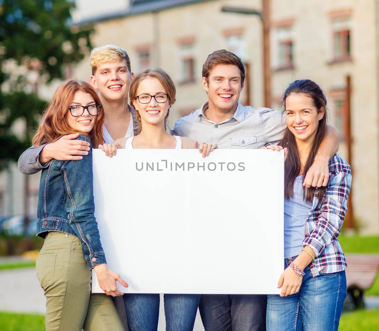 summer holidays, advertisement, education, campus and teenage concept - group of students or teenagers with white blank board