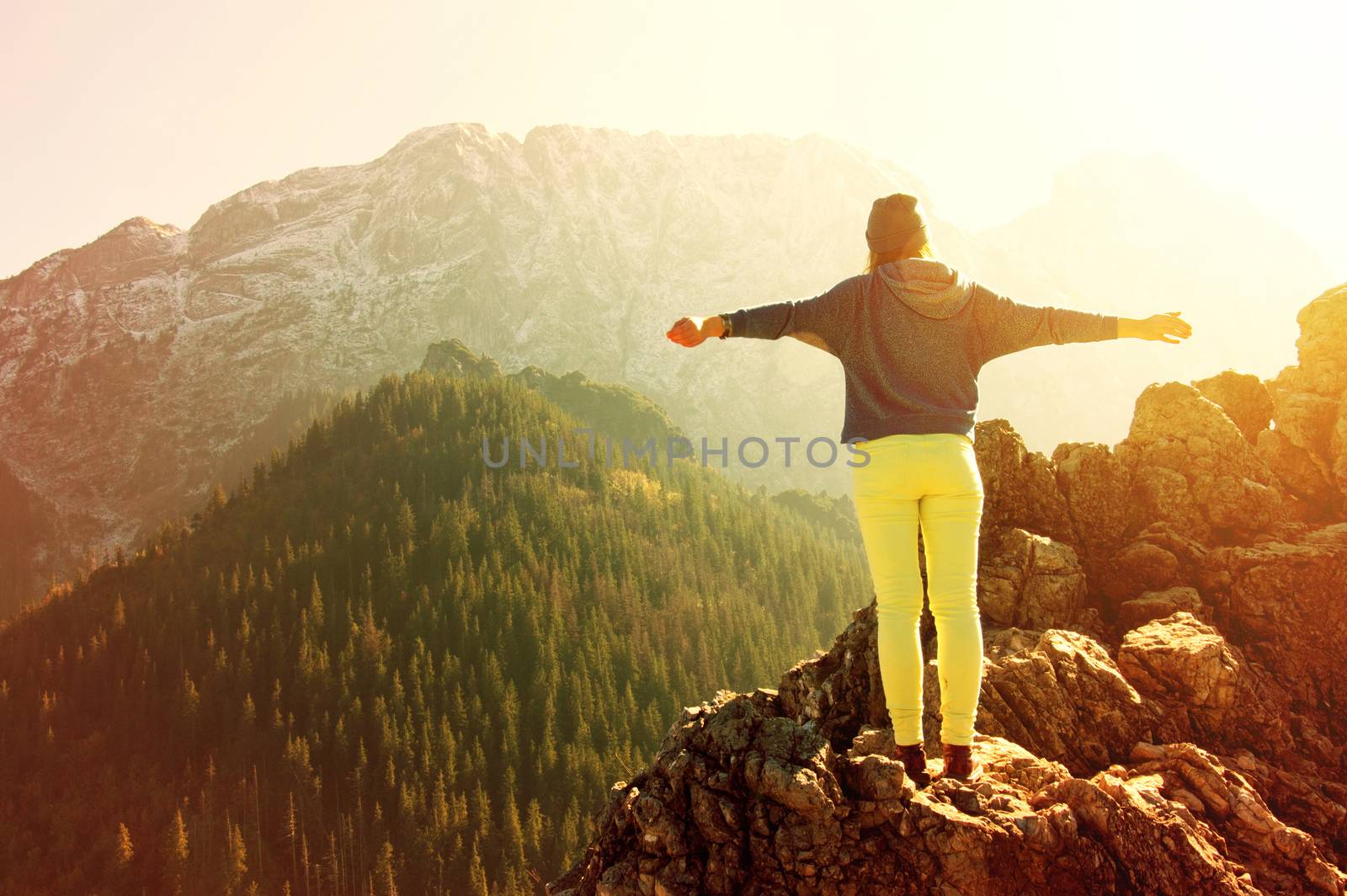 Women feel freedom in mountains scenery. Freedom conceptual image.