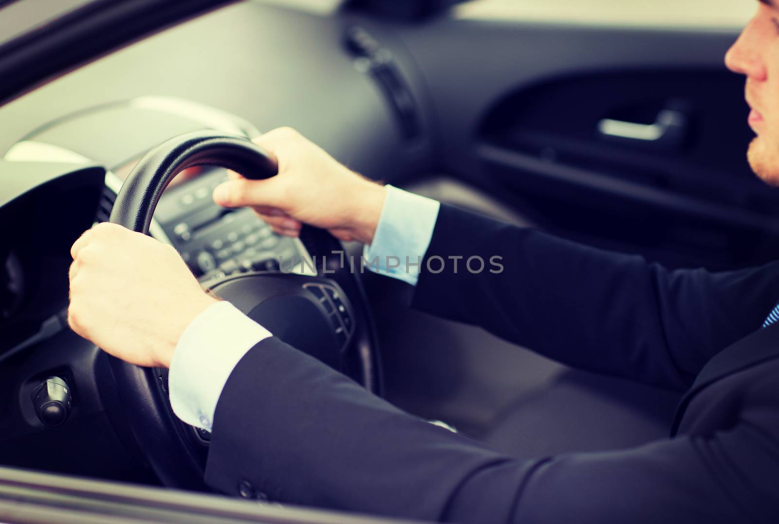 businessman driving a car by dolgachov