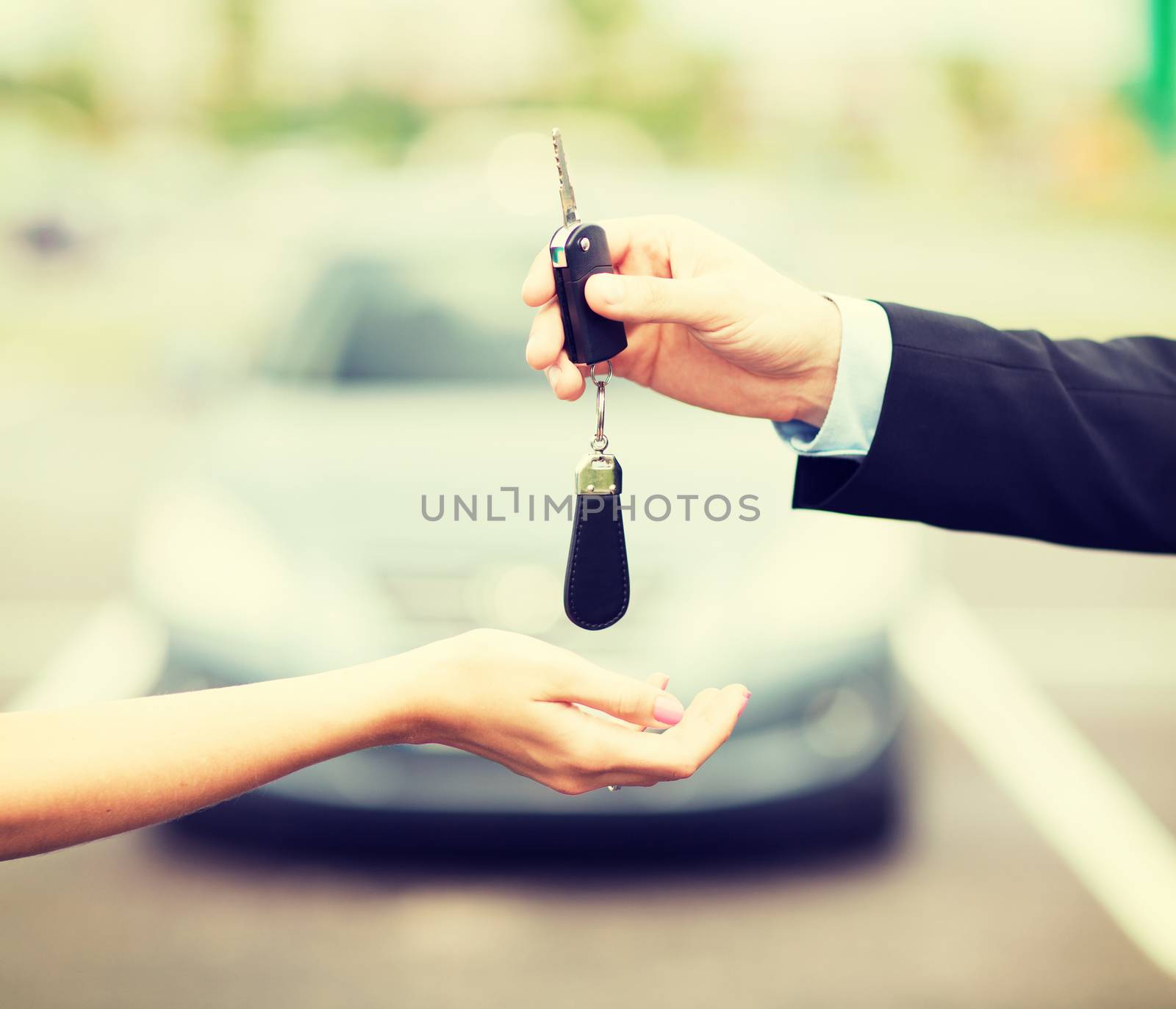 customer and salesman with car key by dolgachov
