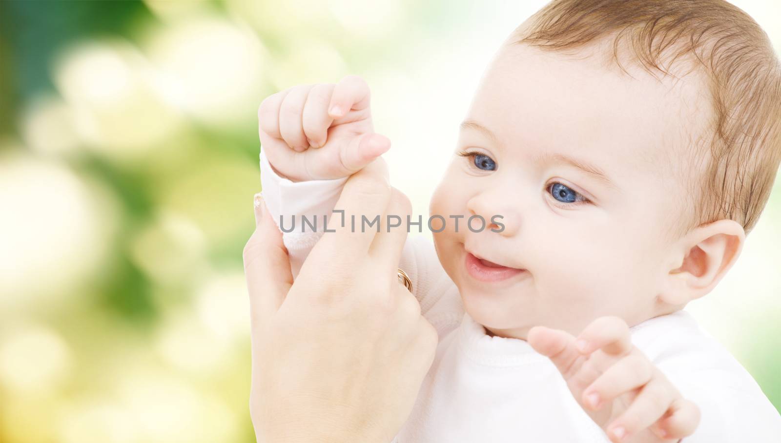 child, happiness and people concept - adorable baby boy