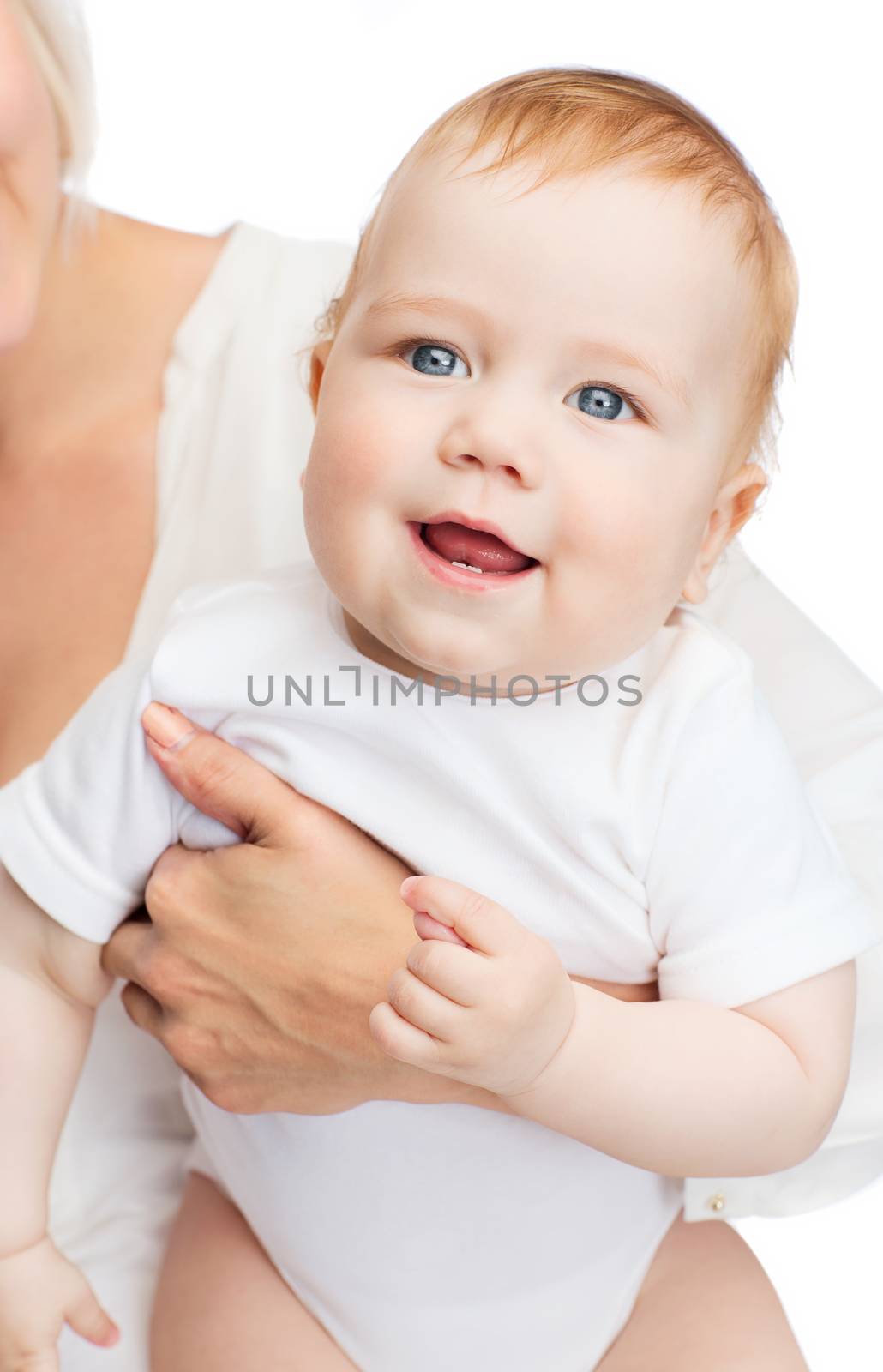 close up of mother holding smiling baby by dolgachov