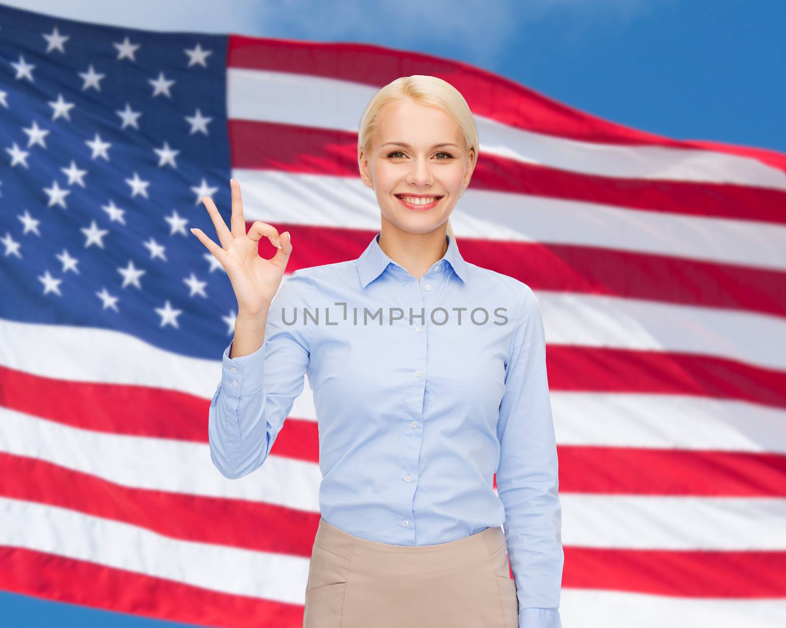 business and education concept - smiling businesswoman showing ok-sign with hand