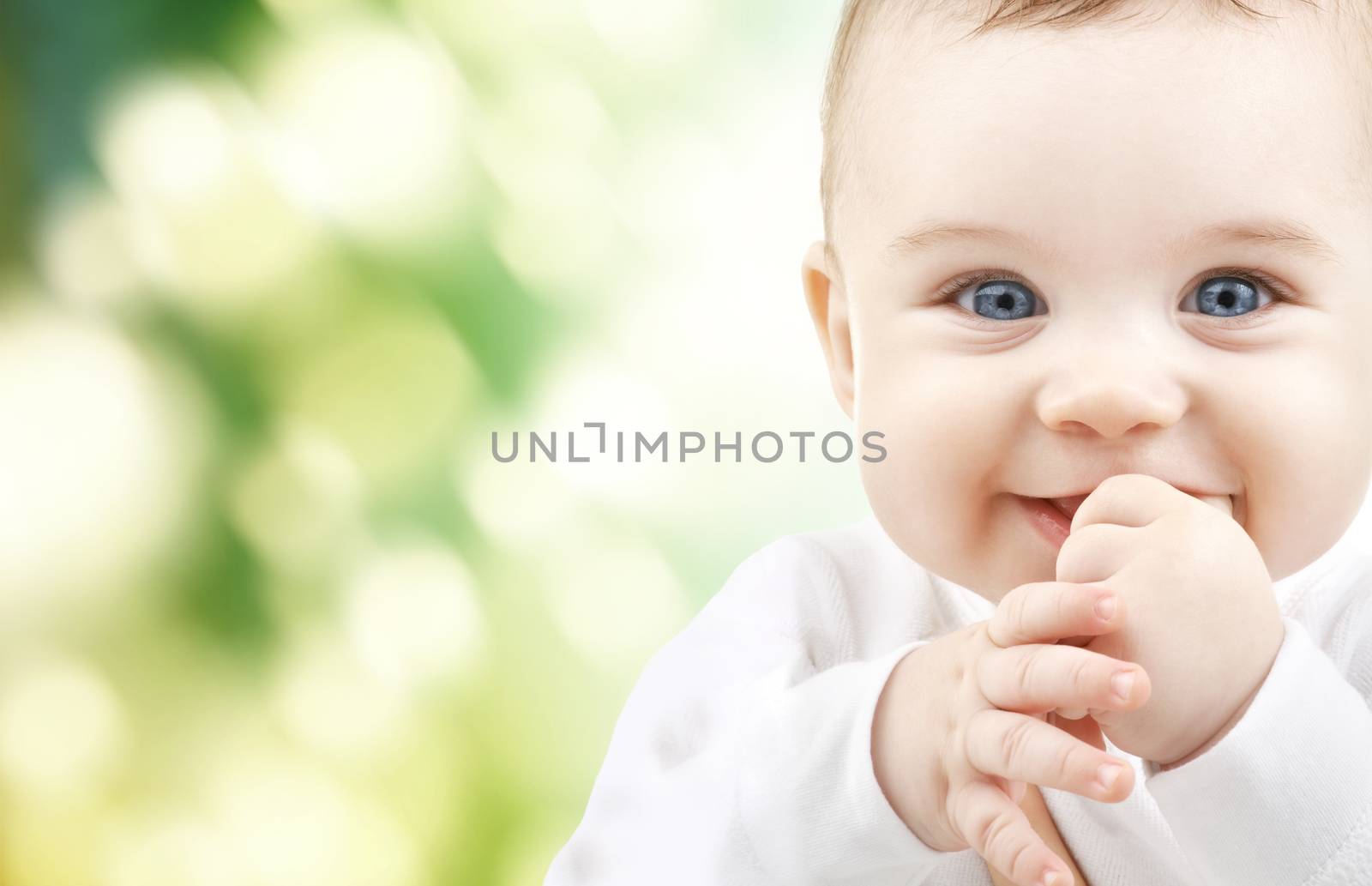 child, happiness and people concept - adorable baby