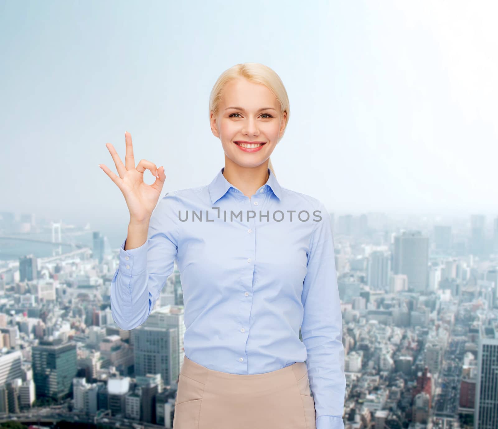 business and education concept - smiling businesswoman showing ok-sign with hand