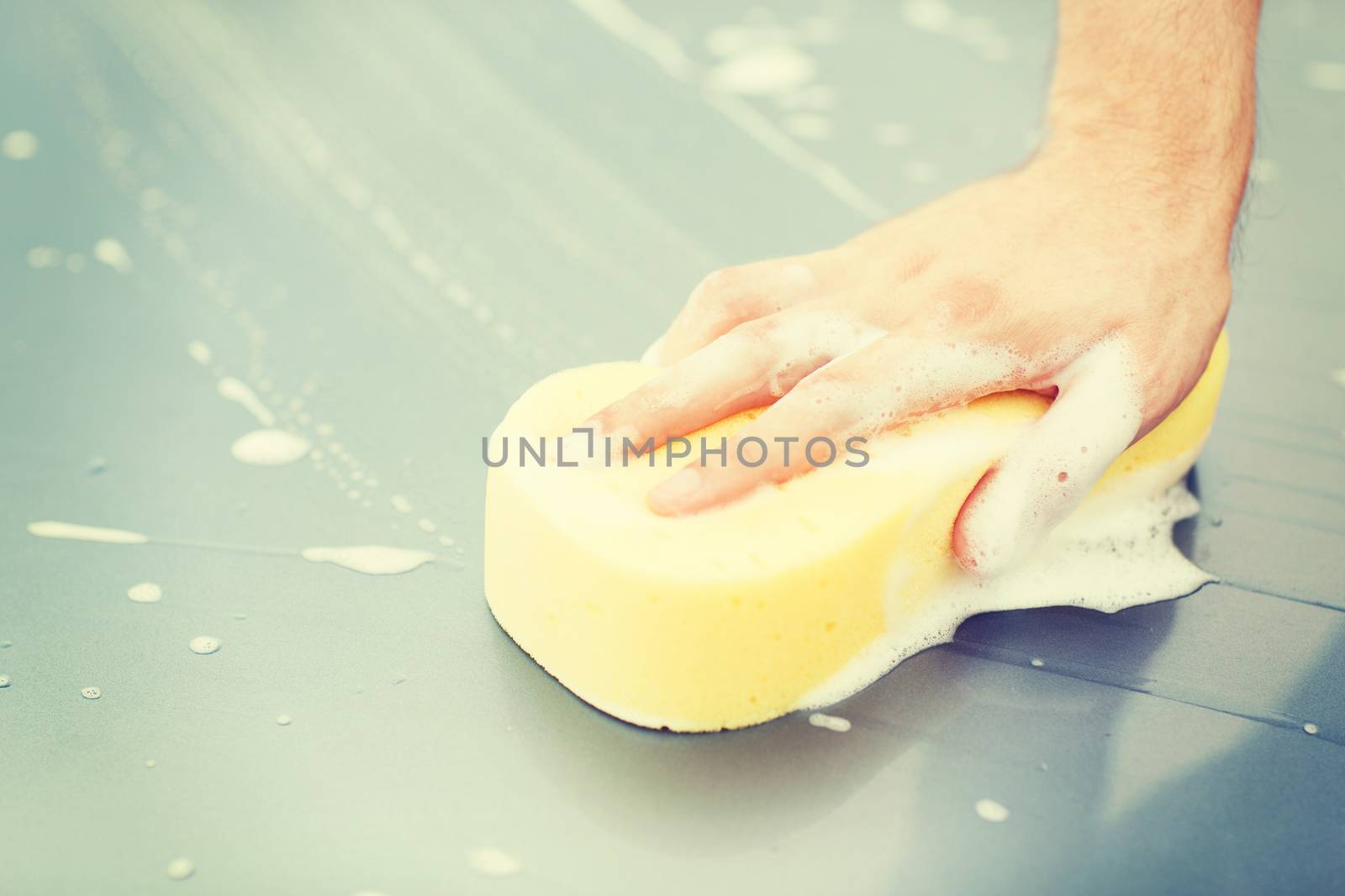man washing a car by dolgachov