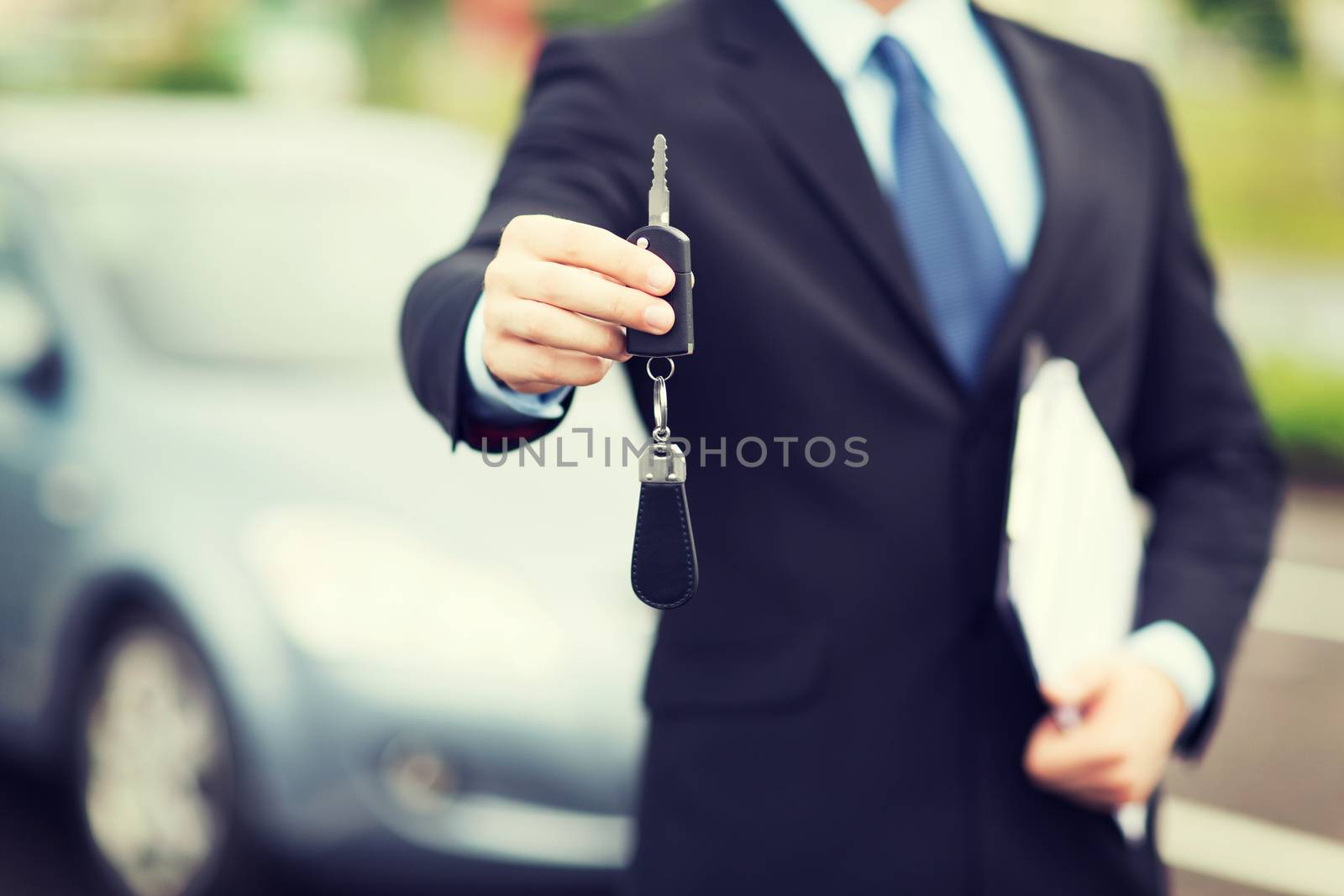 man with car key outside by dolgachov