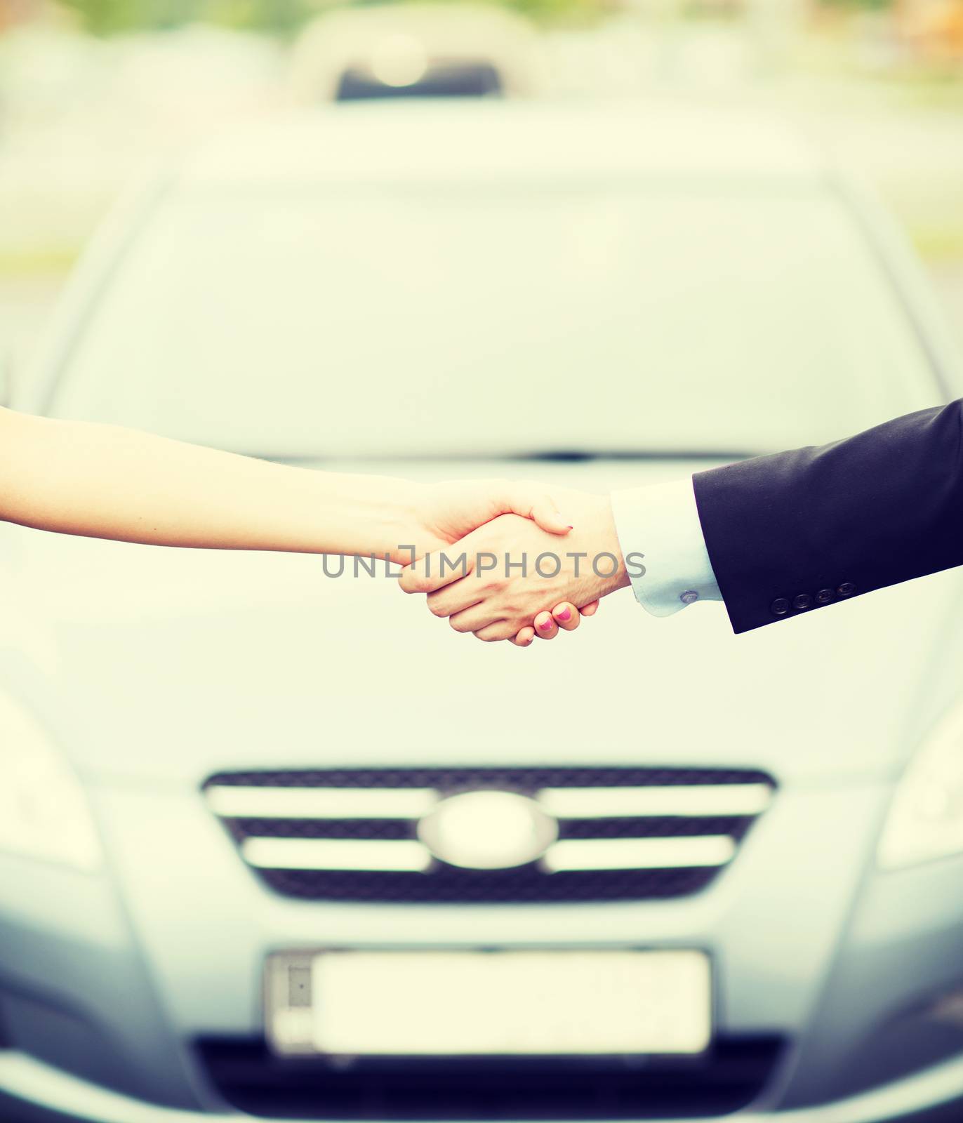 customer and salesman shaking hands by dolgachov