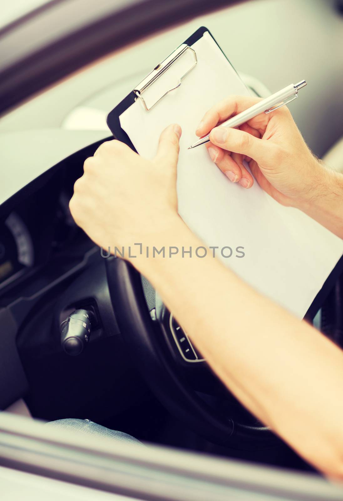 transportation and ownership concept - man with car documents