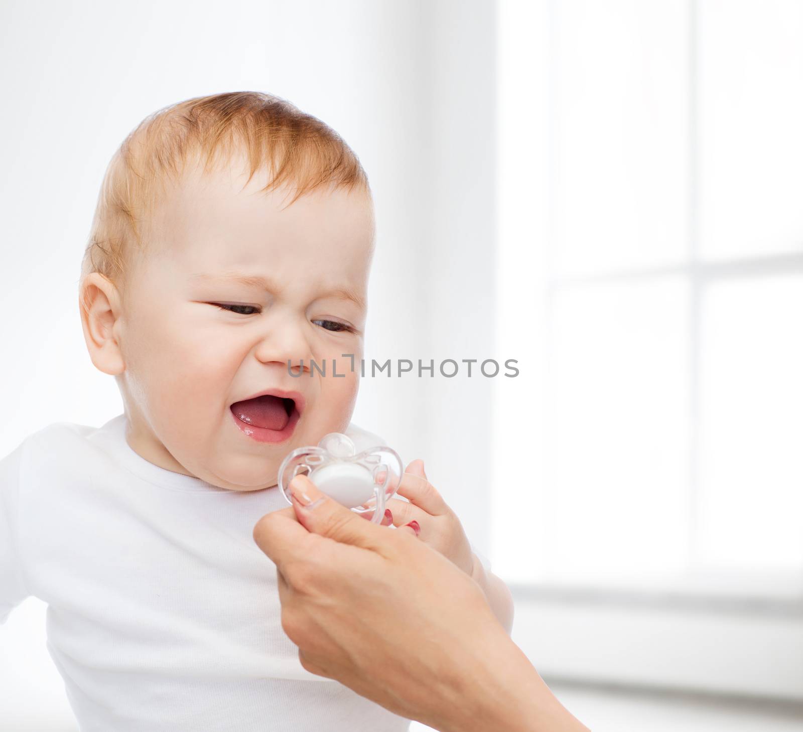 crying baby with dummy by dolgachov