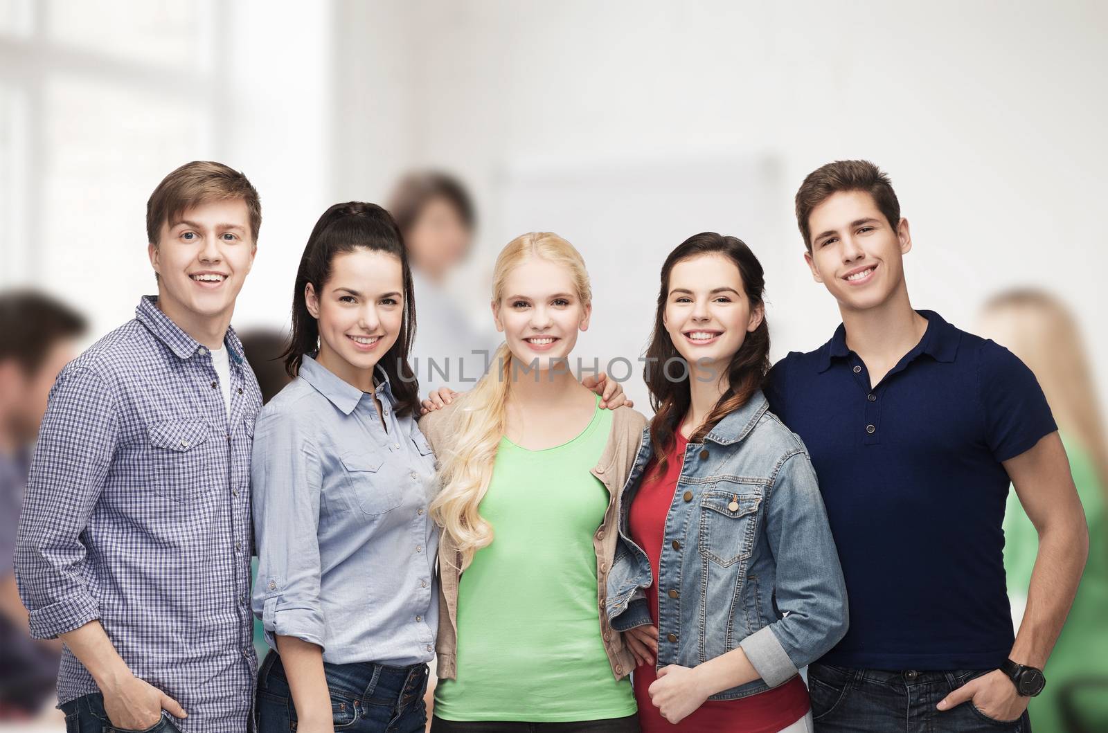 education and people concept - group of standing smiling students