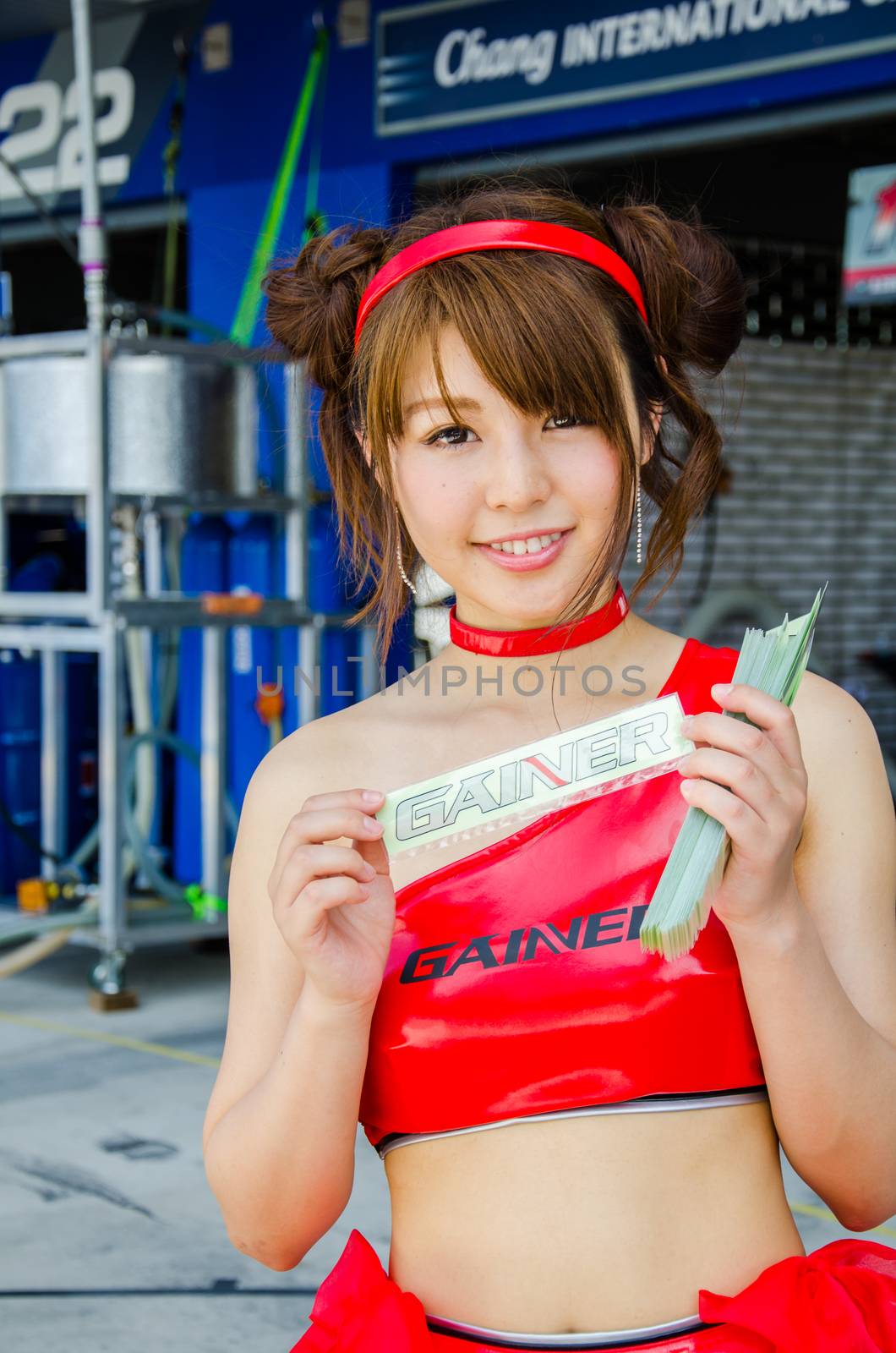 BURIRAM - JUNE 20: Unidentified Race Queen of Japan with racing car on display at The 2015 Autobacs Super GT Series Race 3 on June 20, 2015 at Chang International Racing Circuit, Buriram Thailand